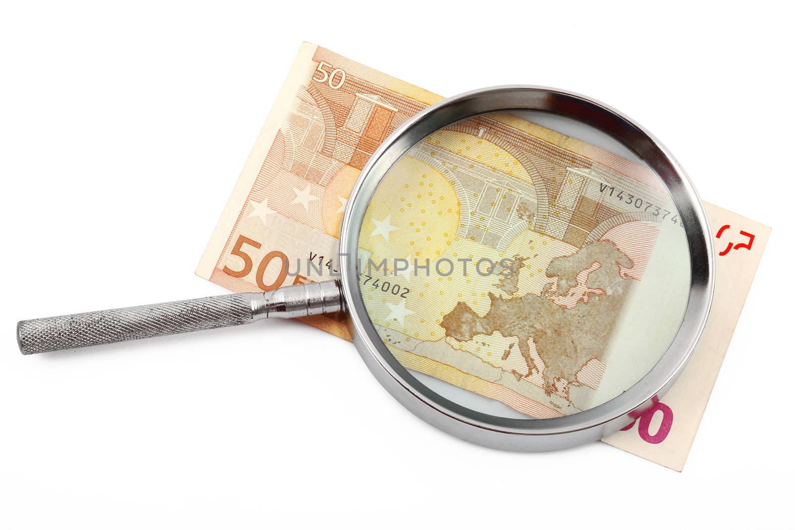 Money under magnifying glass on white background