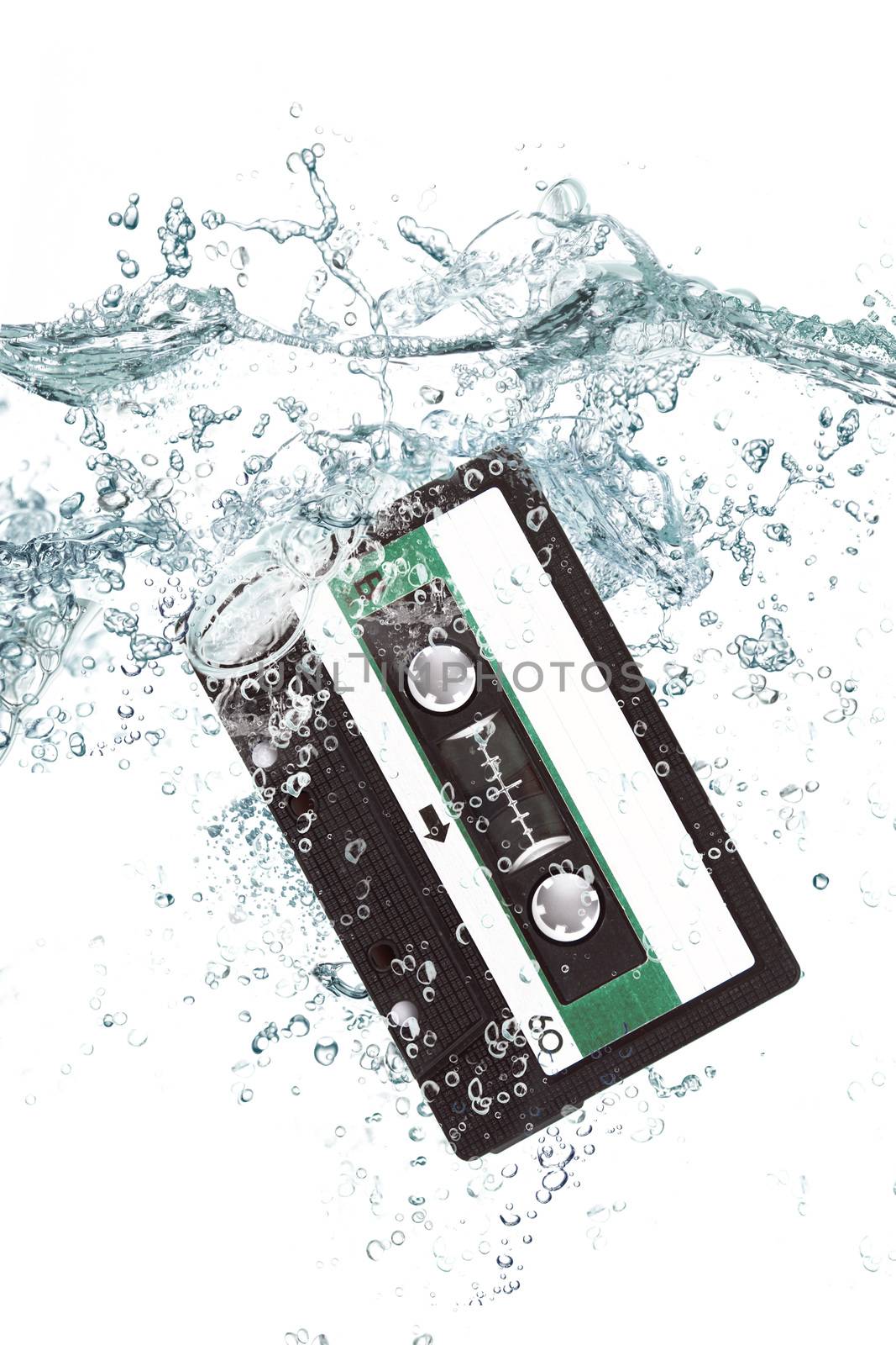 old audio cassette falling in water