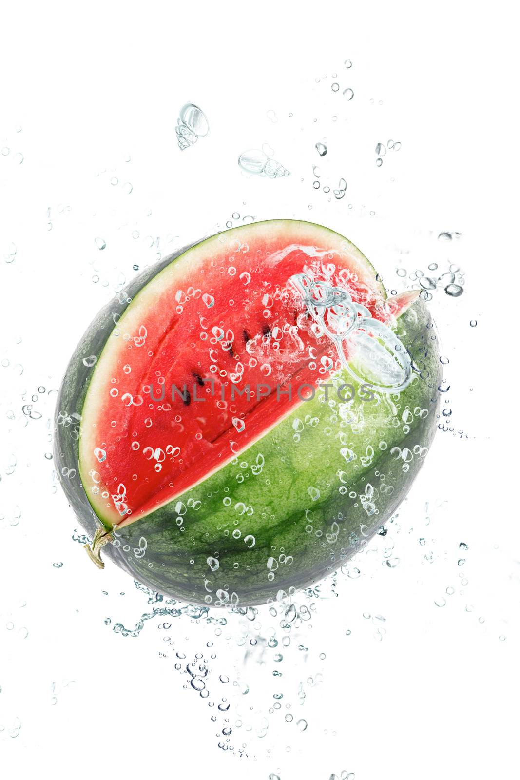 fresh watermelon falling in water