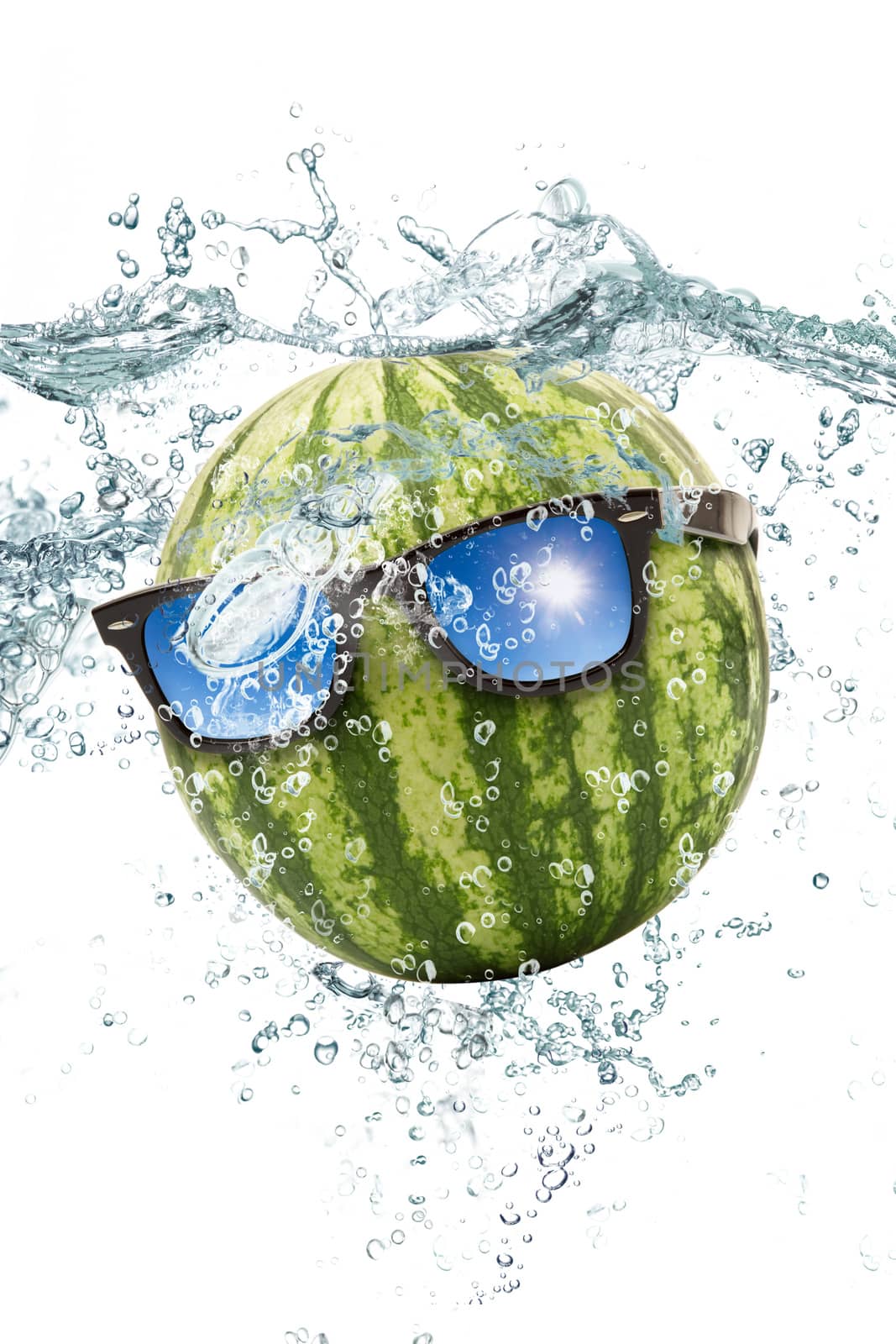 fresh watermelon falling in water