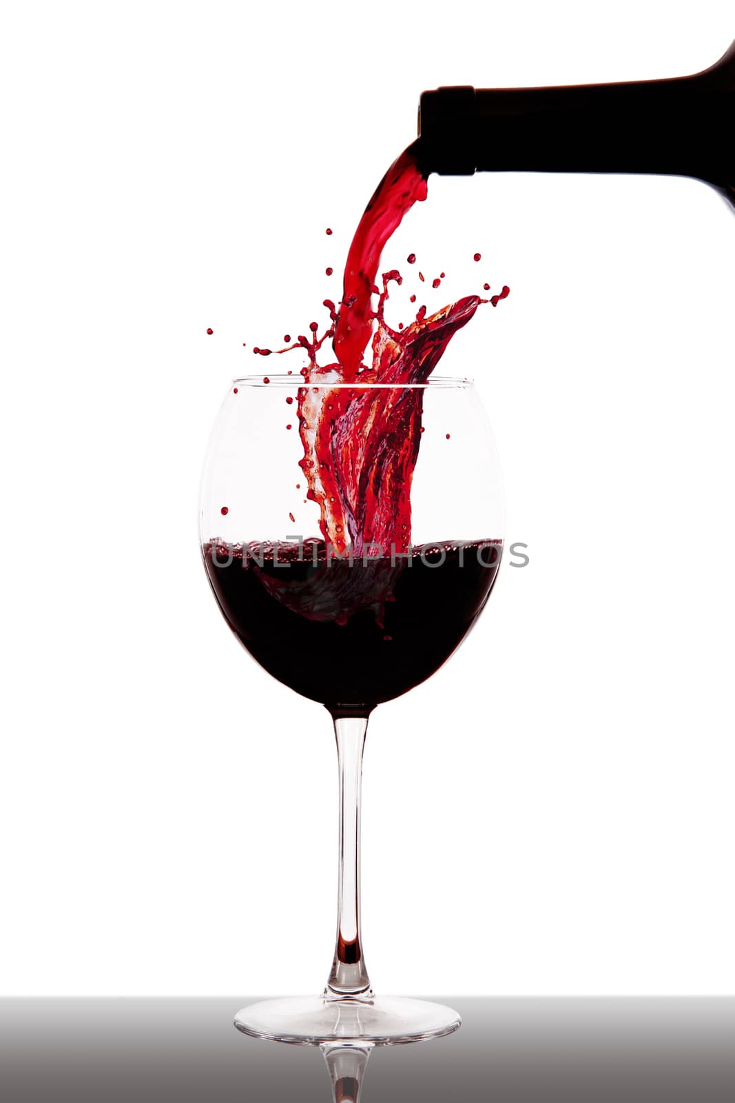 a glass with ice and wine splash