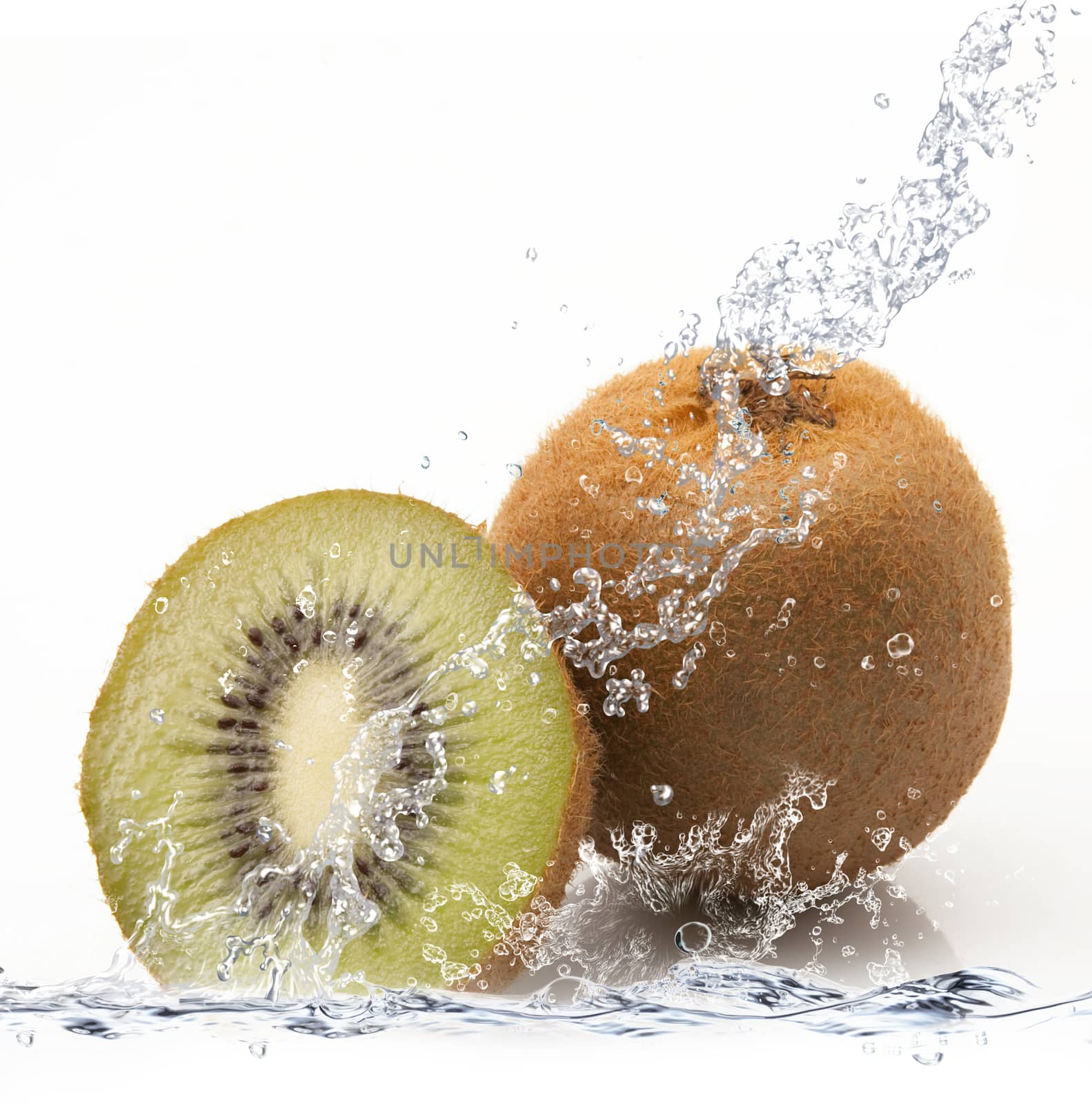 fresh kiwi falling in water