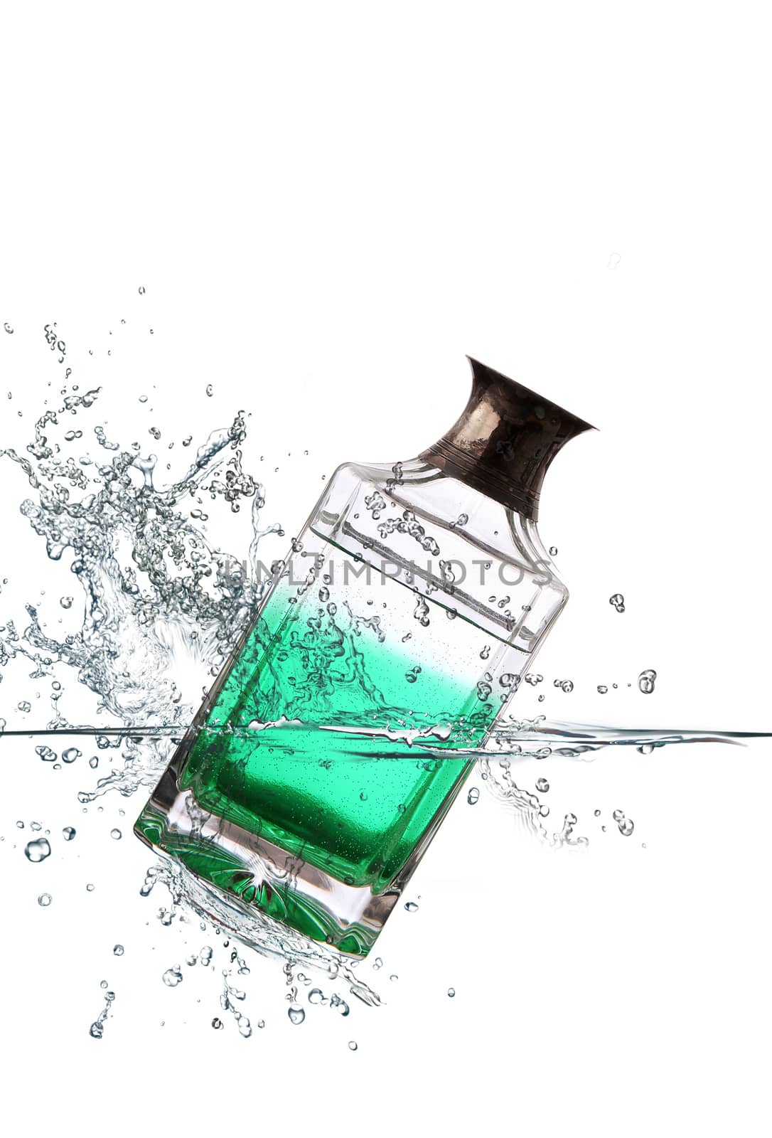green glass bottle falling in water