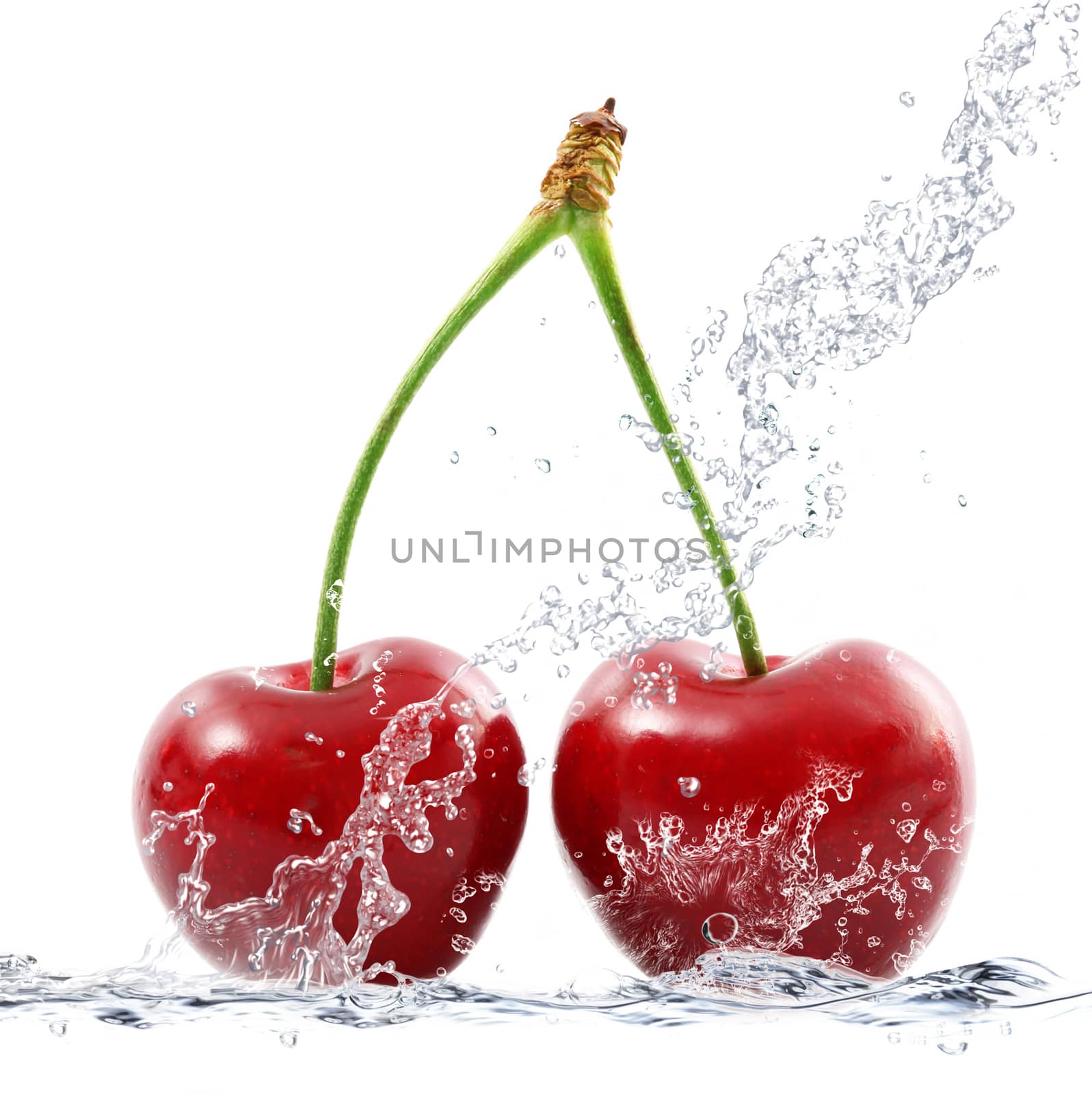 fresh cherries falling in water