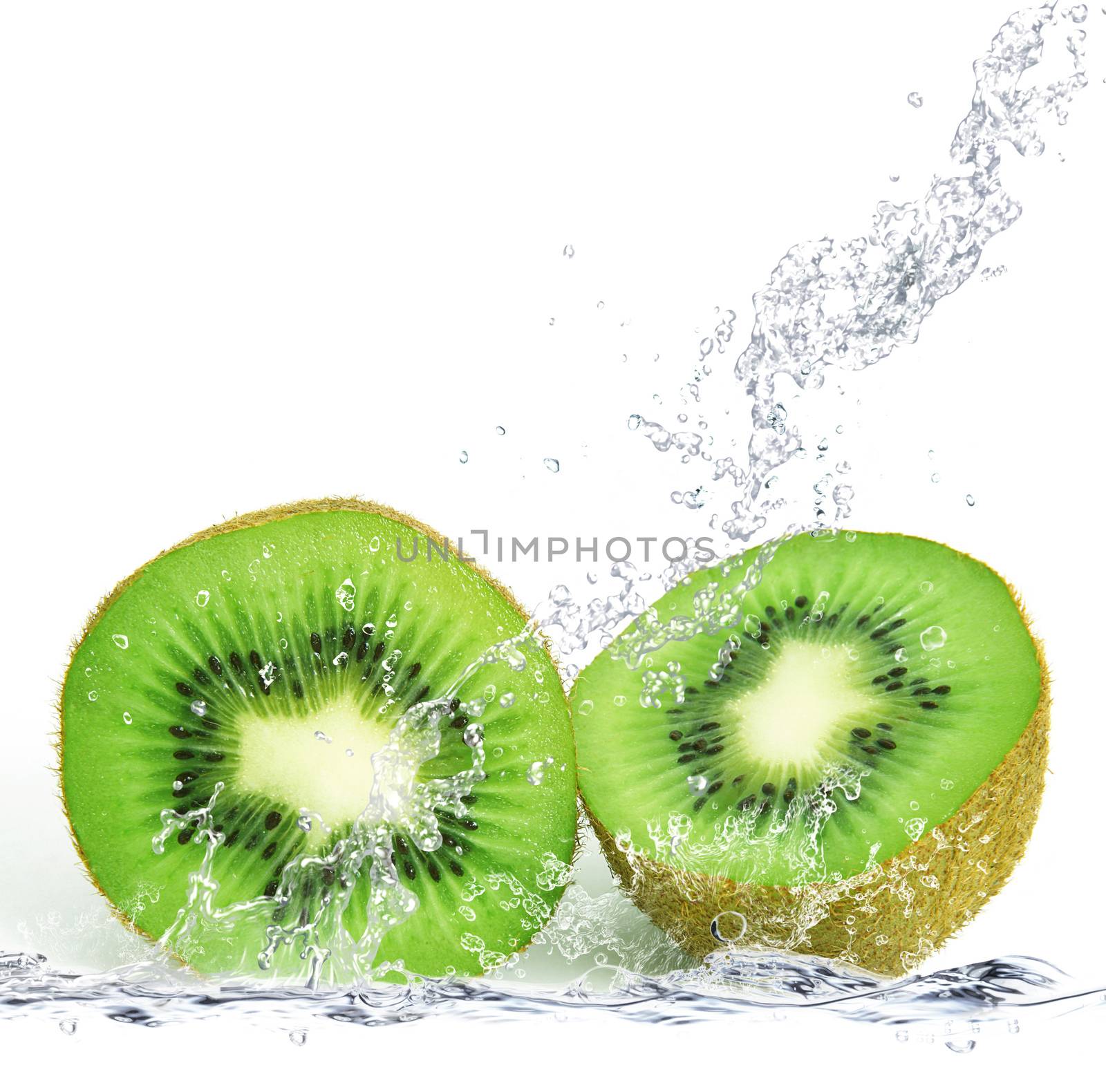 fresh kiwi falling in water