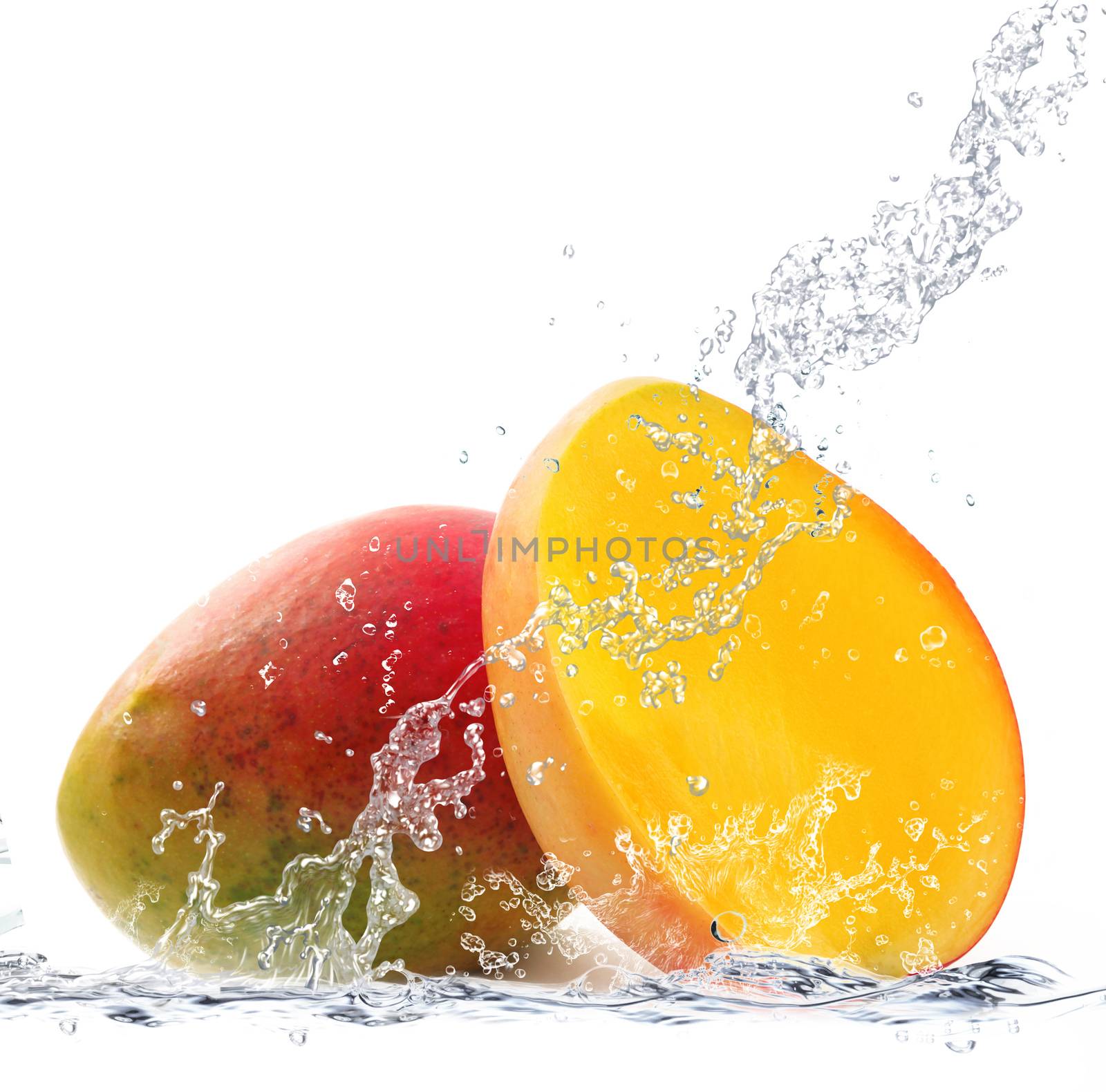 fresh mango falling in water
