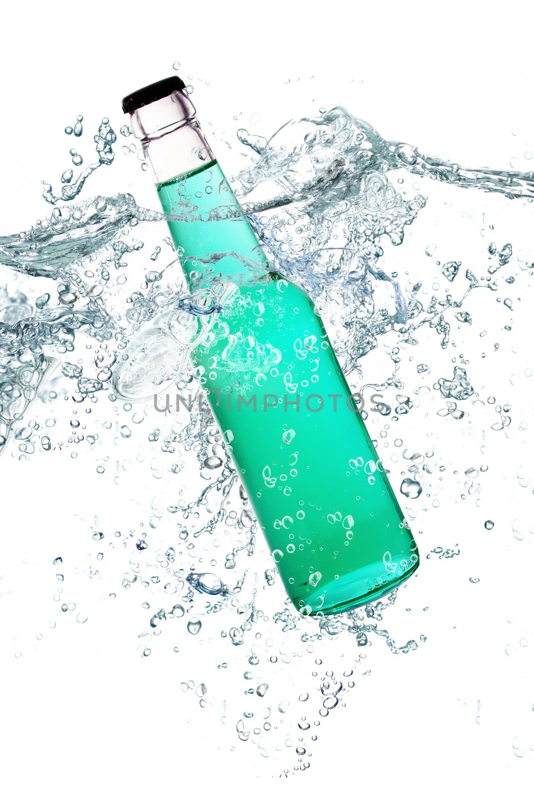 green glass bottle falling in water