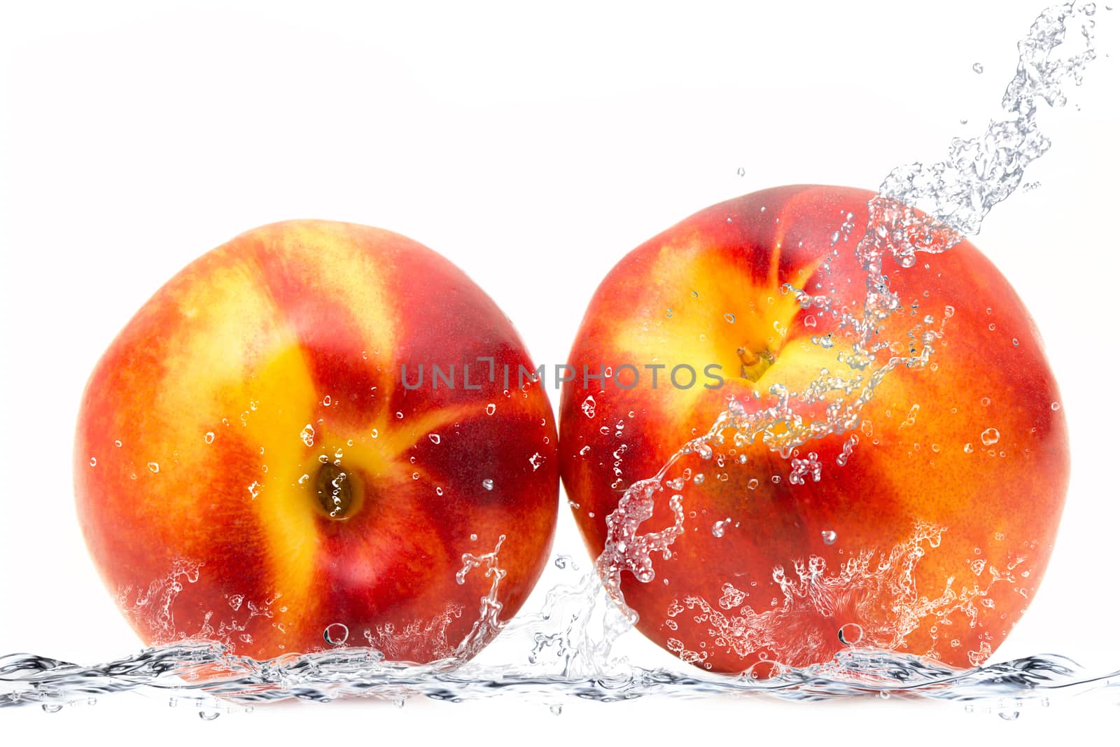 fresh peach falling in water