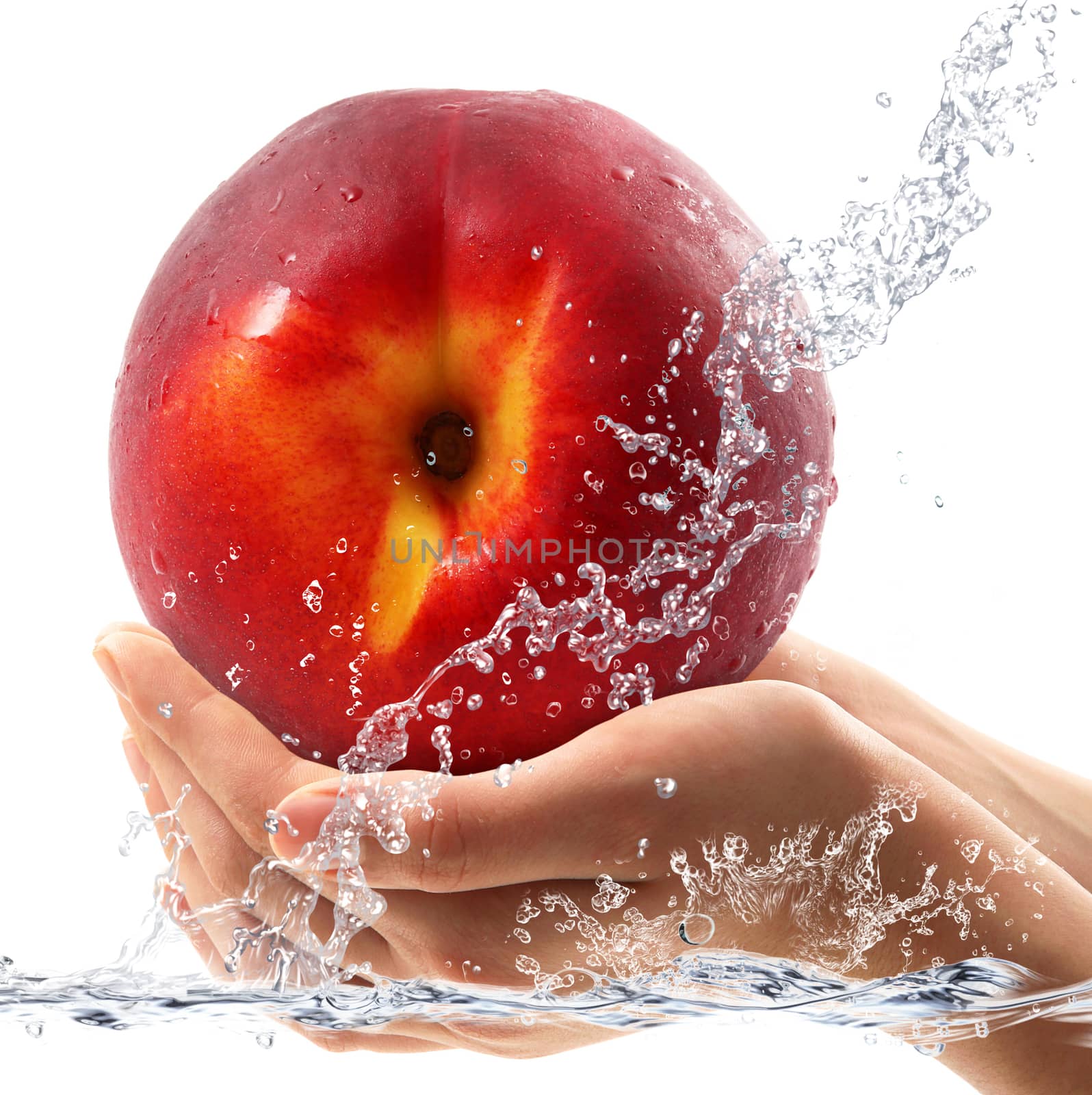 fresh peach falling in water