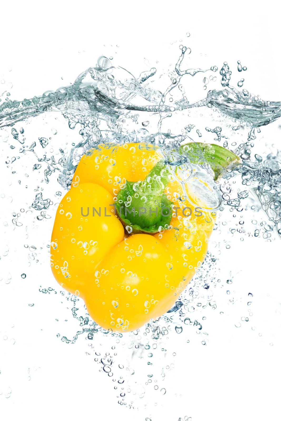 fresh peppers falling in pure water