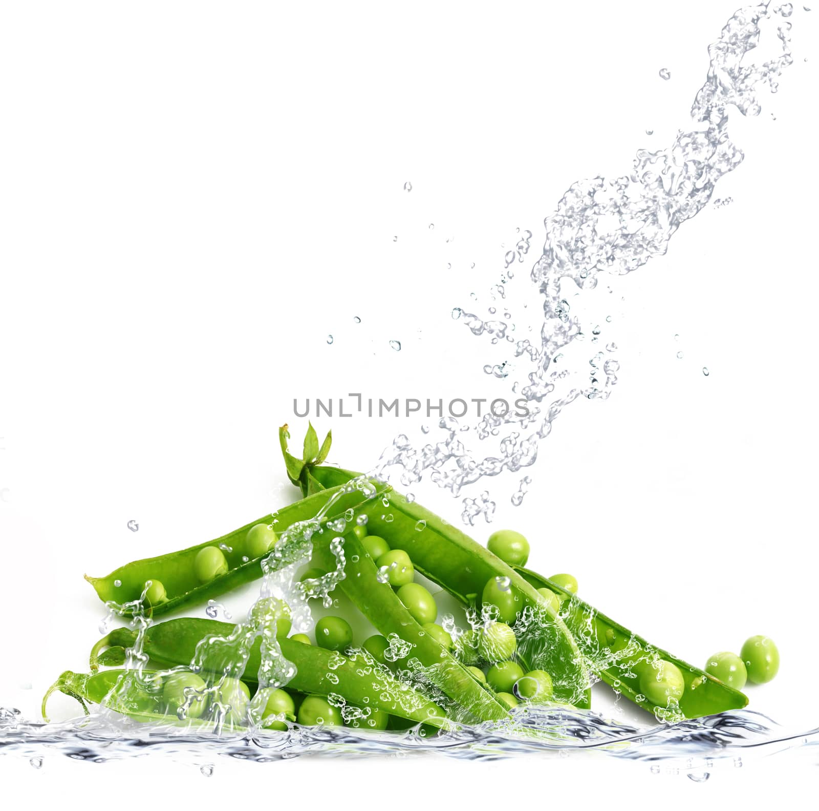fresh peas falling in pure water