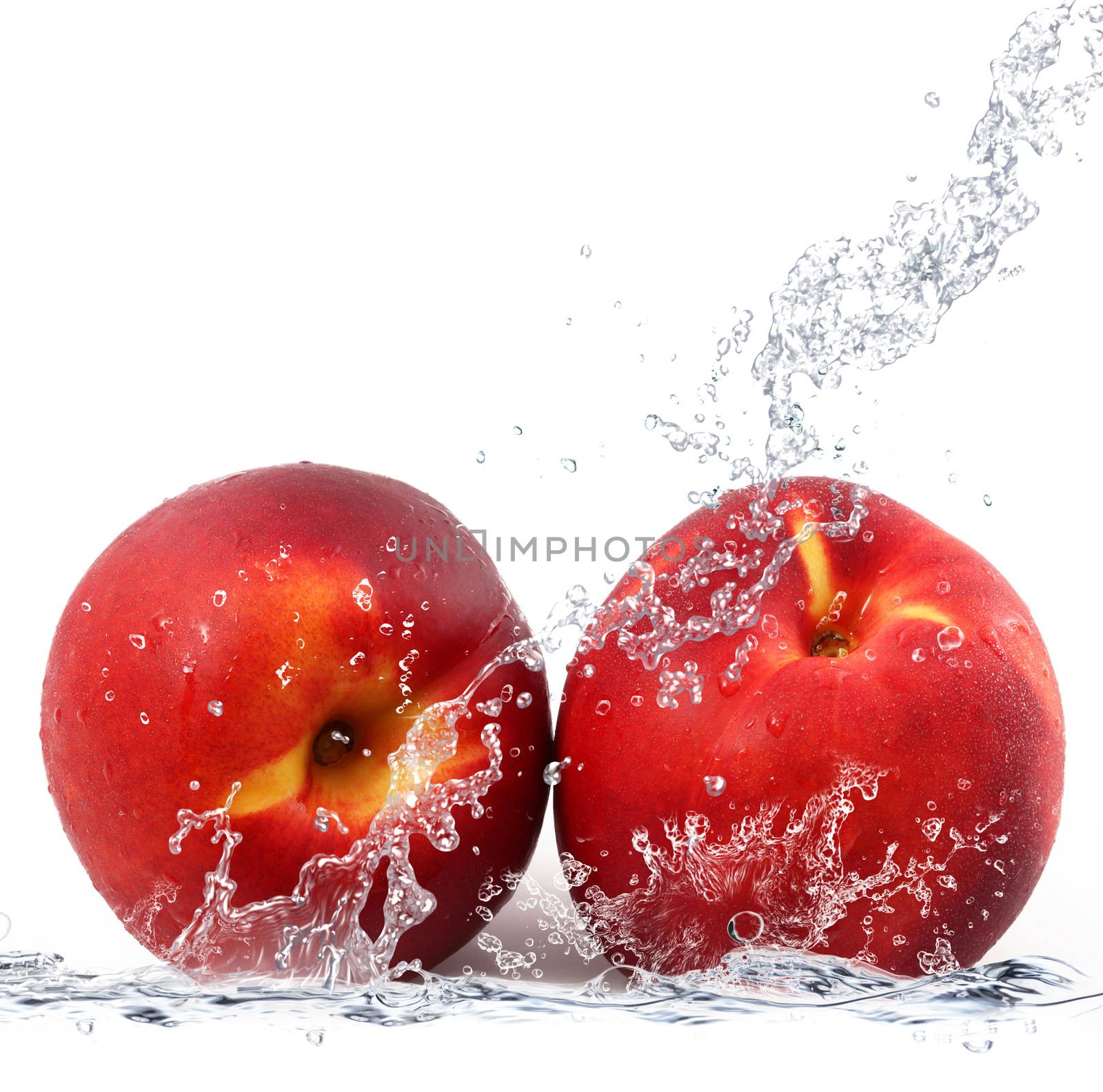 fresh peach falling in water