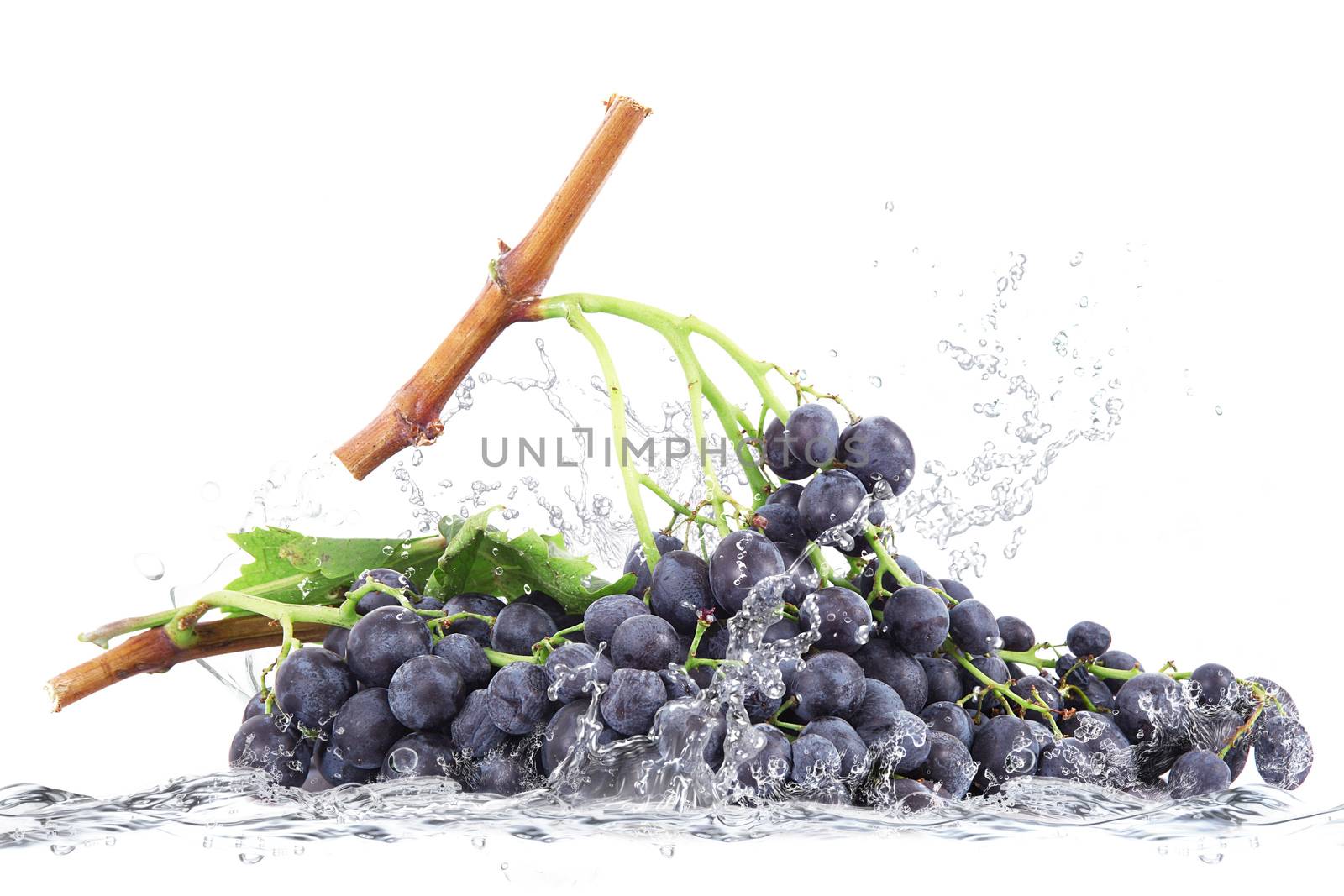 fresh grapes falling in water