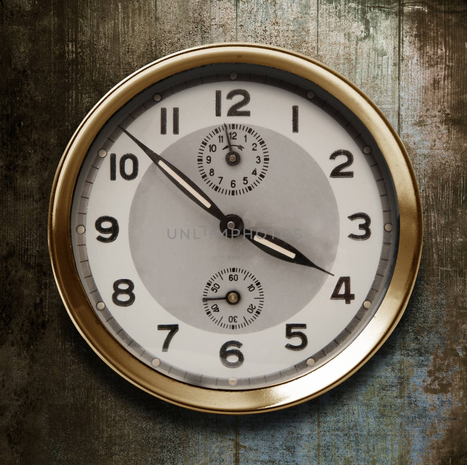 a vintage watch on a wooden background