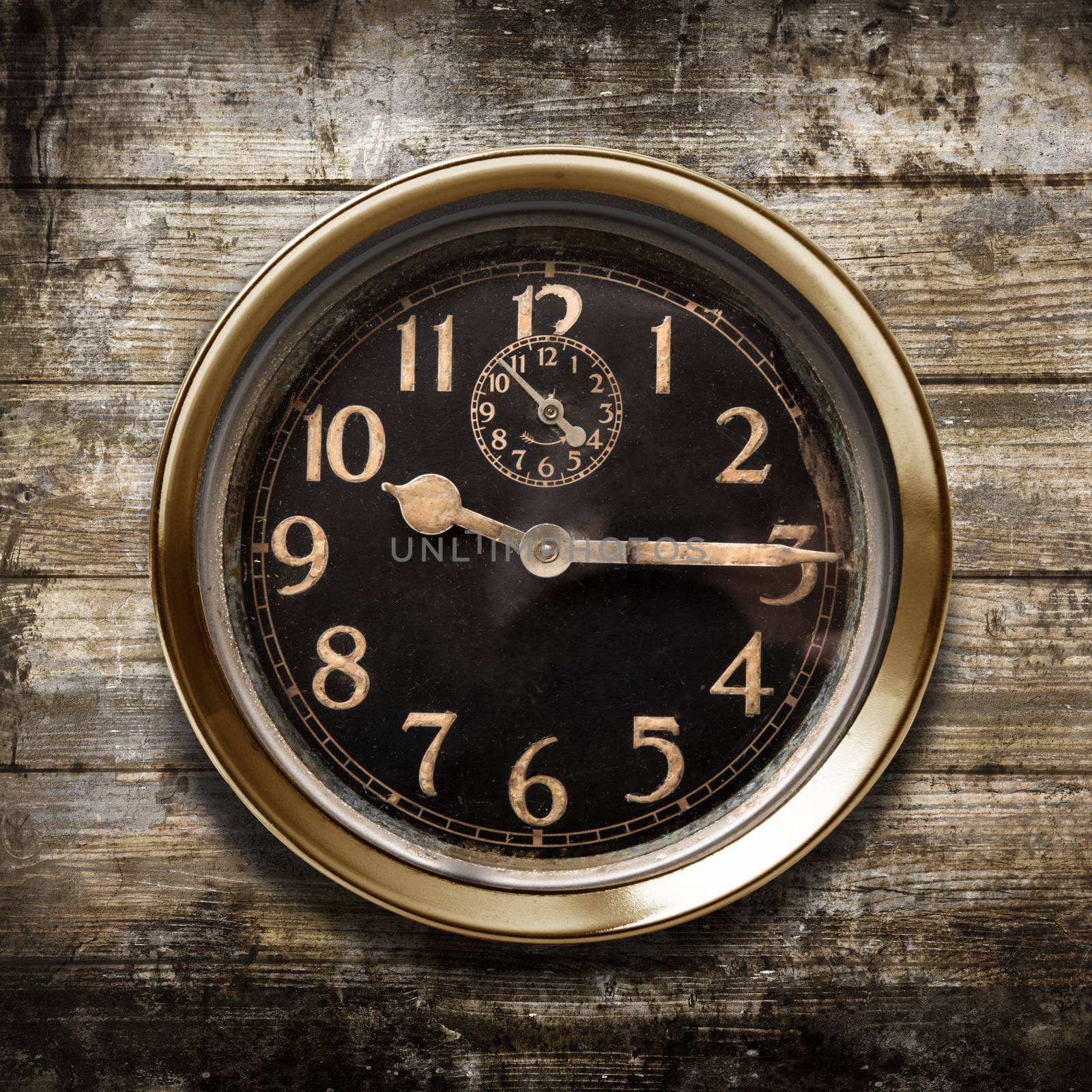 a vintage watch on a wooden background