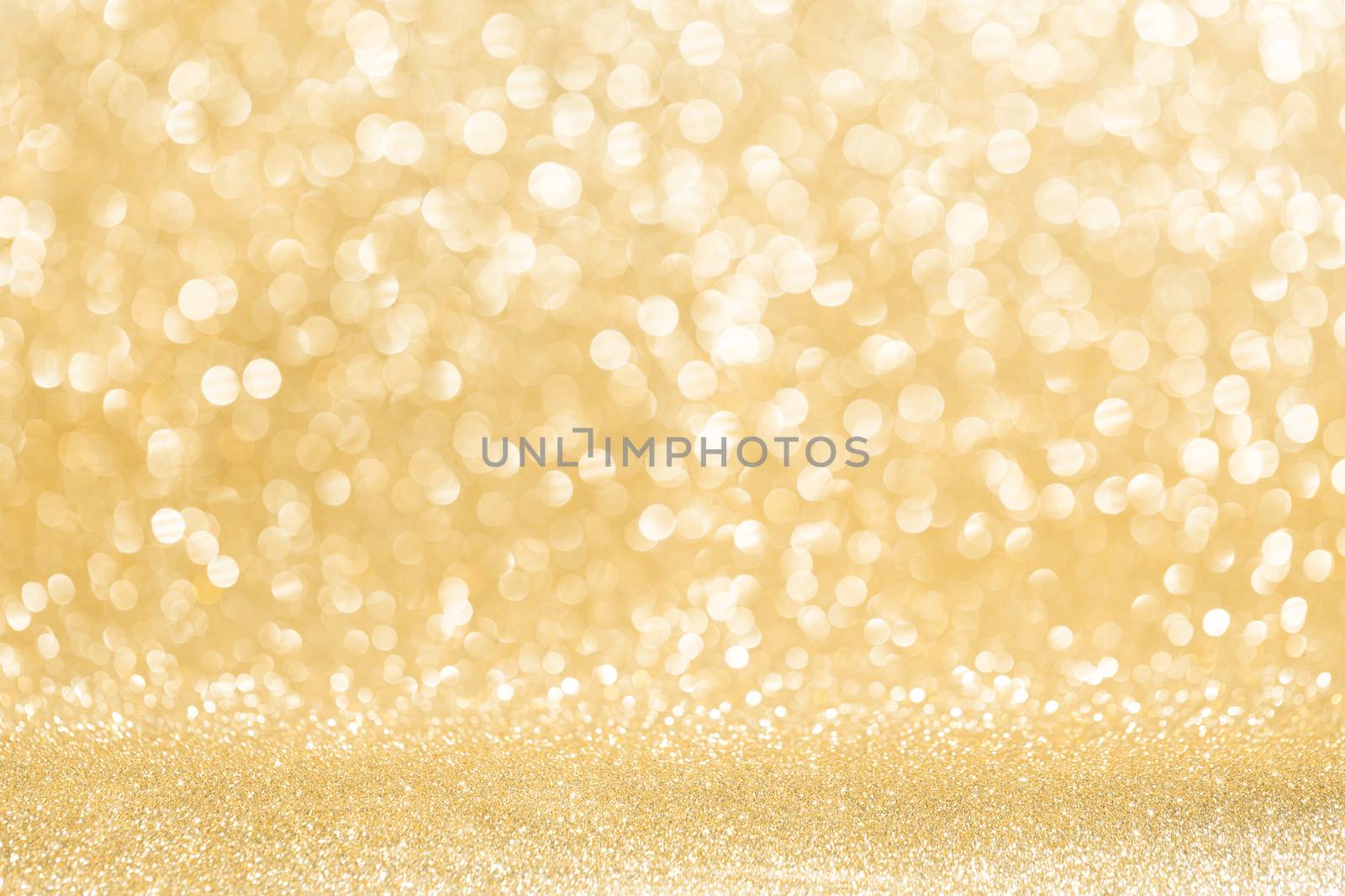 Abstract shining glitters gold holiday bokeh background with copy space for text