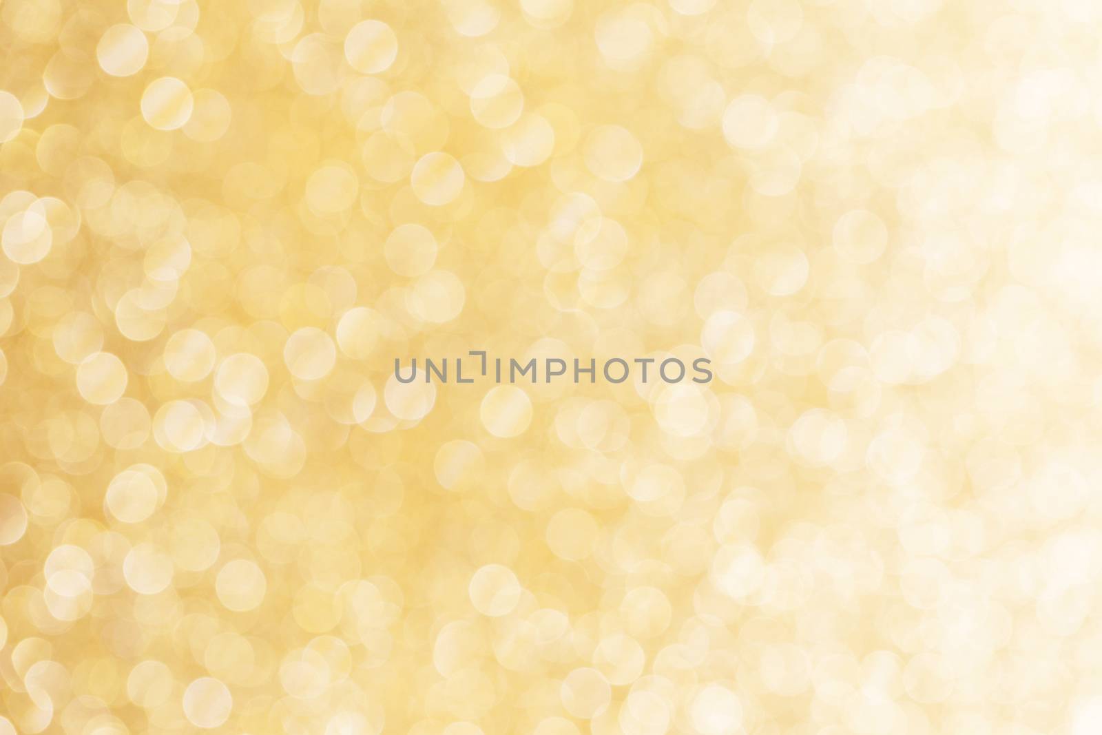 Abstract shining glitters gold holiday bokeh background with copy space for text