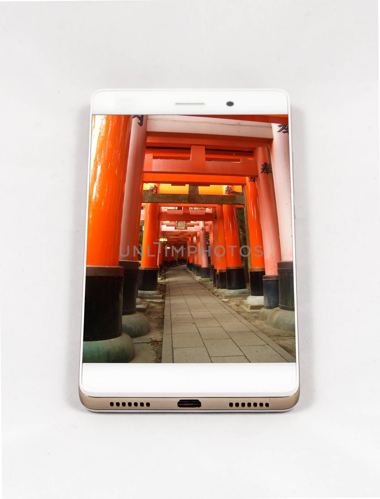 Modern smartphone displaying full screen picture of Kyoto, Japan by marcorubino