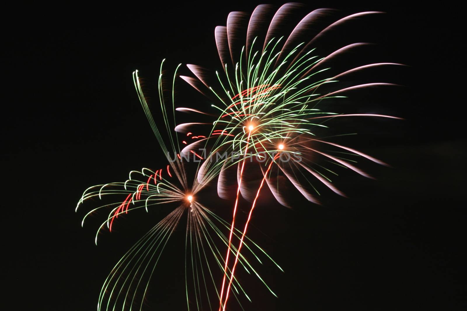 colorful fireworks on the black sky background over-water celebration by Roman1030