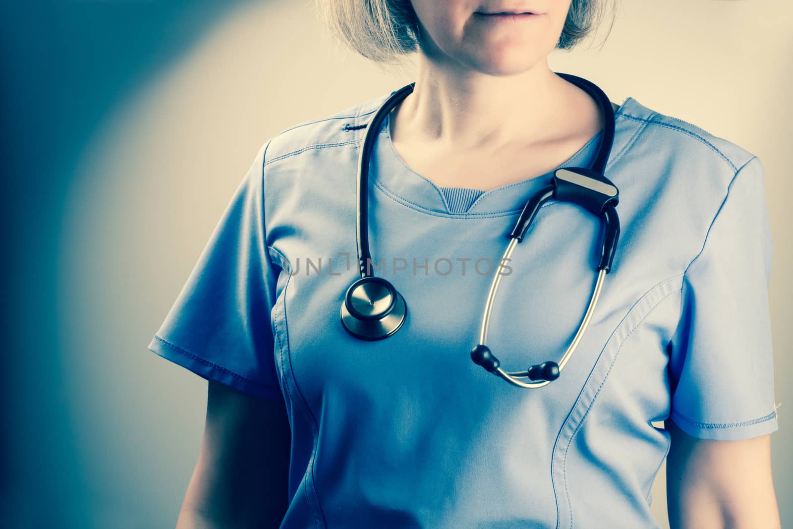 Closeup on a mature nurse with stethoscope