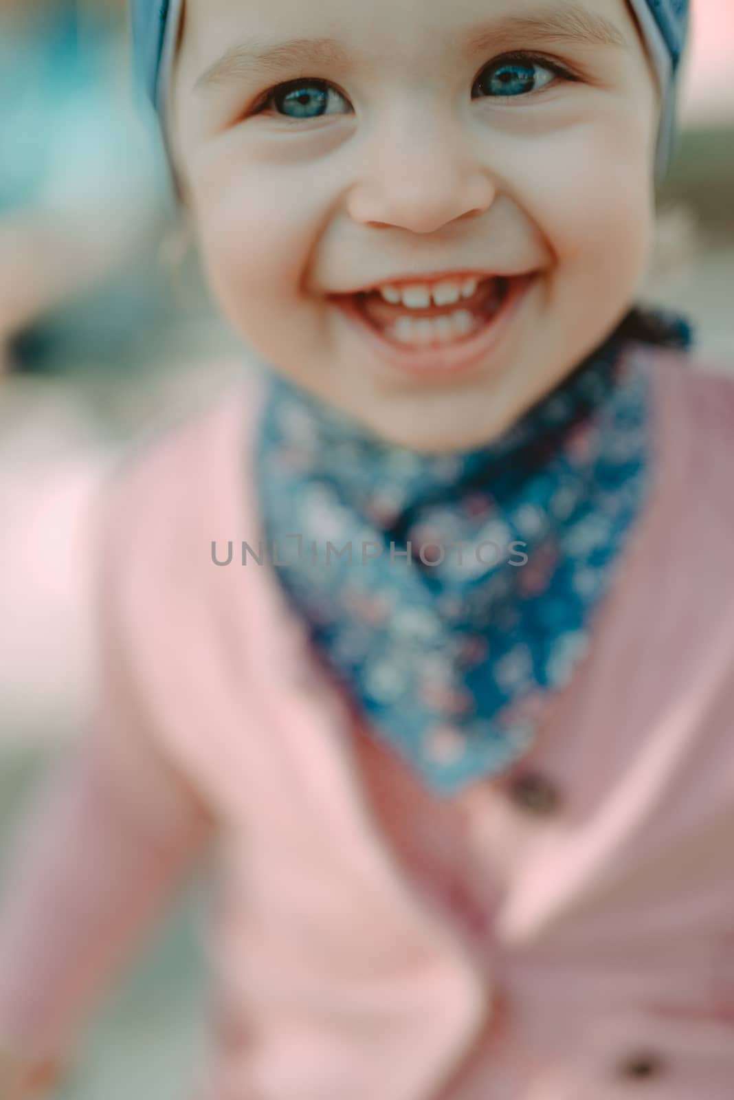 Adorable girl having fun on beautiful autumn day. Authentic picture.