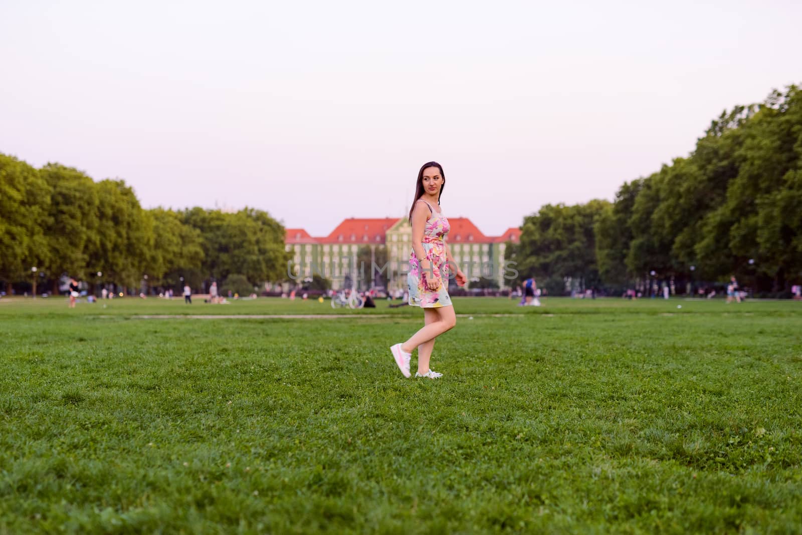 Autumn attractive woman portrait smiling outdoors at the park. Authentic and natural photographs
