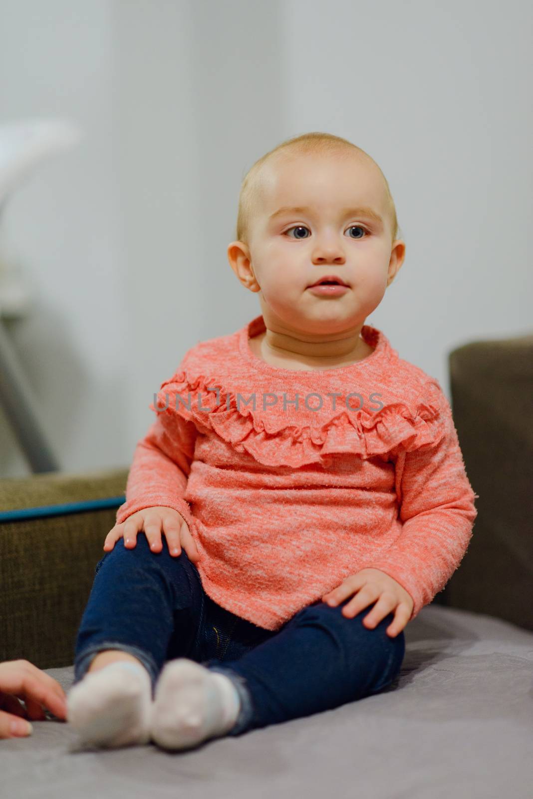 Portrait of adorable baby girl. Childhood.