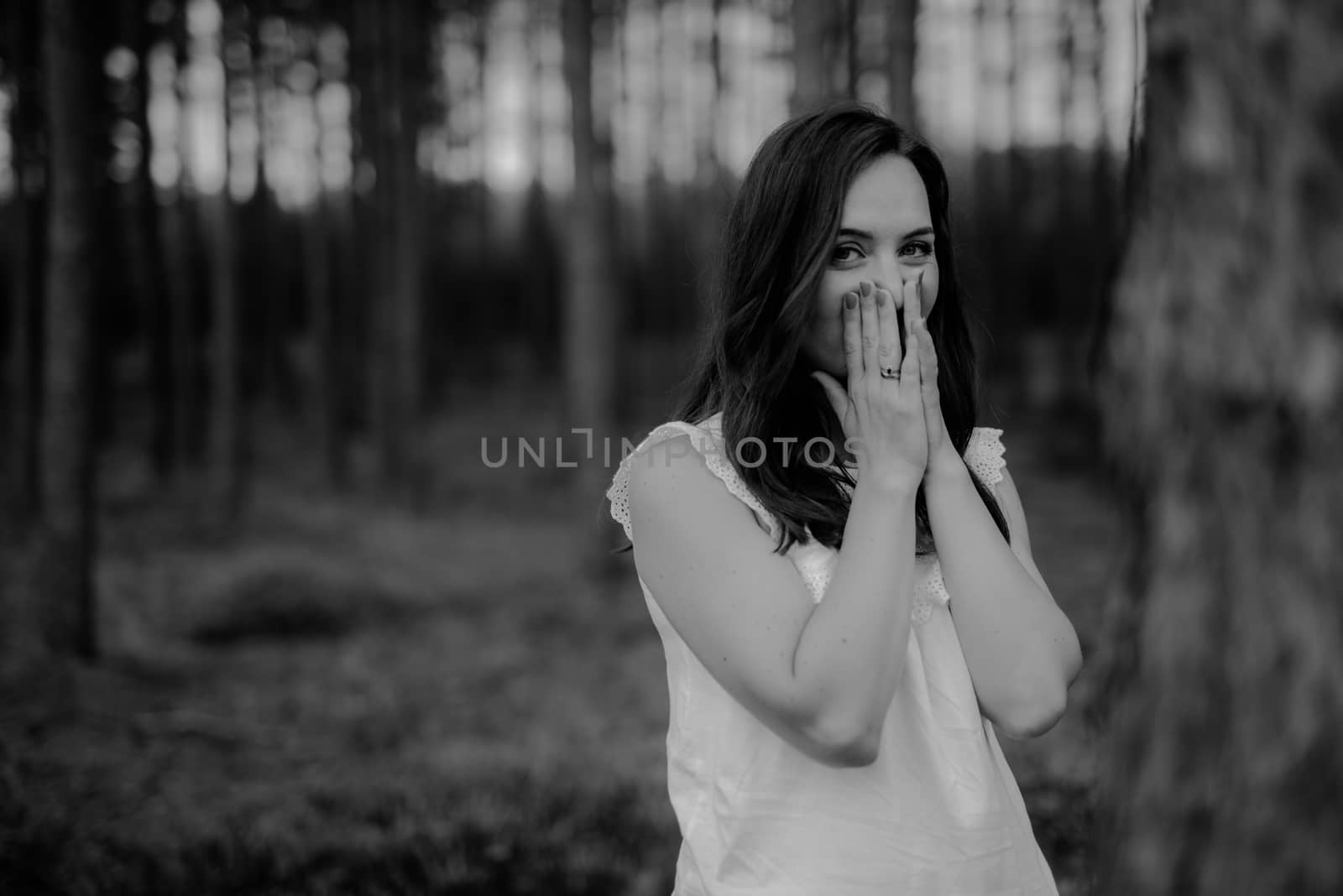 Woman in the forest where the purple heather blooms. copy space. Authentic lifestyle image. by Brejeq