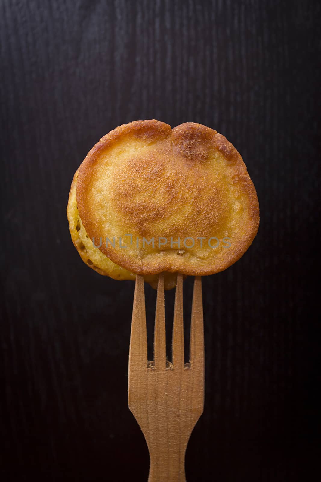 Fritters on a wooden fork by VIPDesignUSA