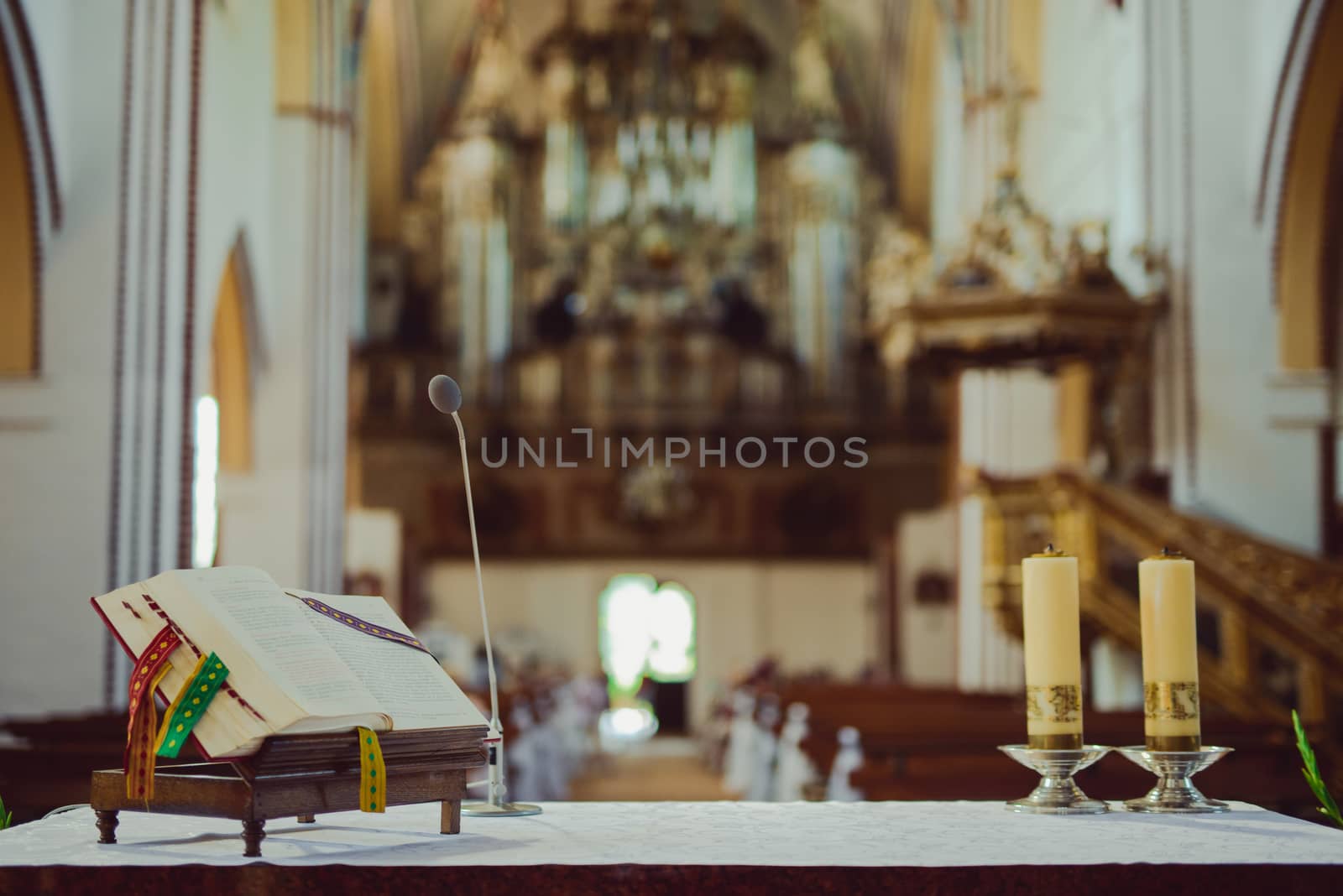 Church sanctuary before a wedding ceremony. Empty chairs for bride and groom
