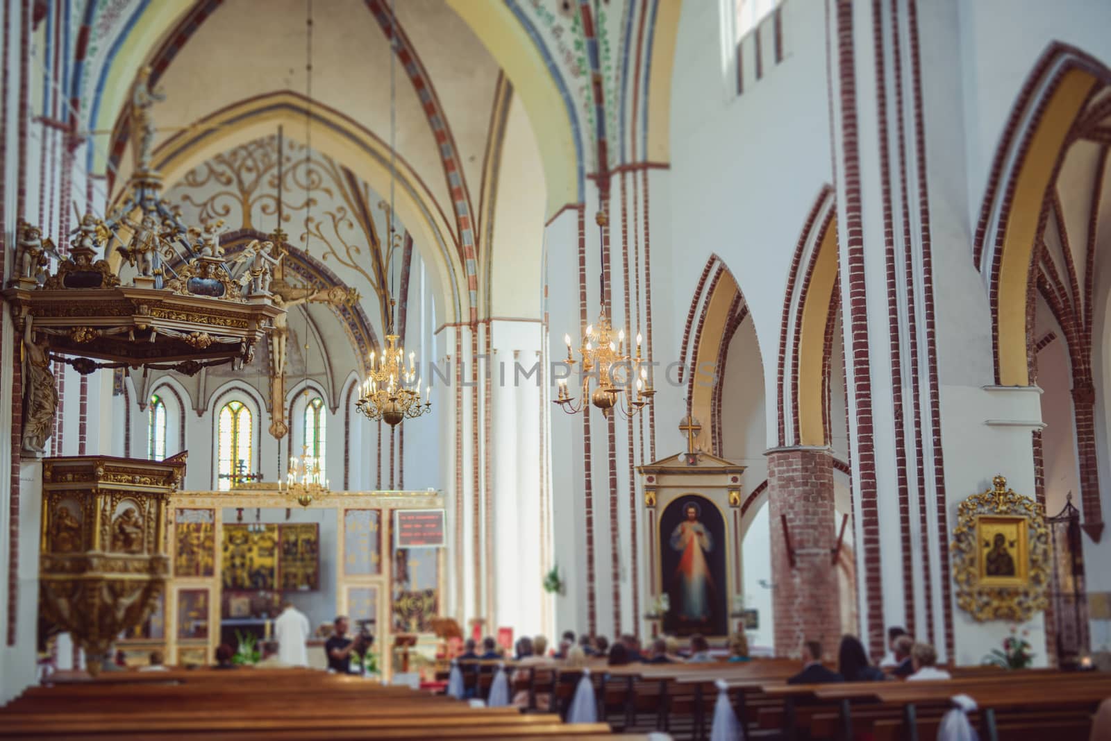 Church sanctuary before a wedding ceremony. Empty chairs for bride and groom