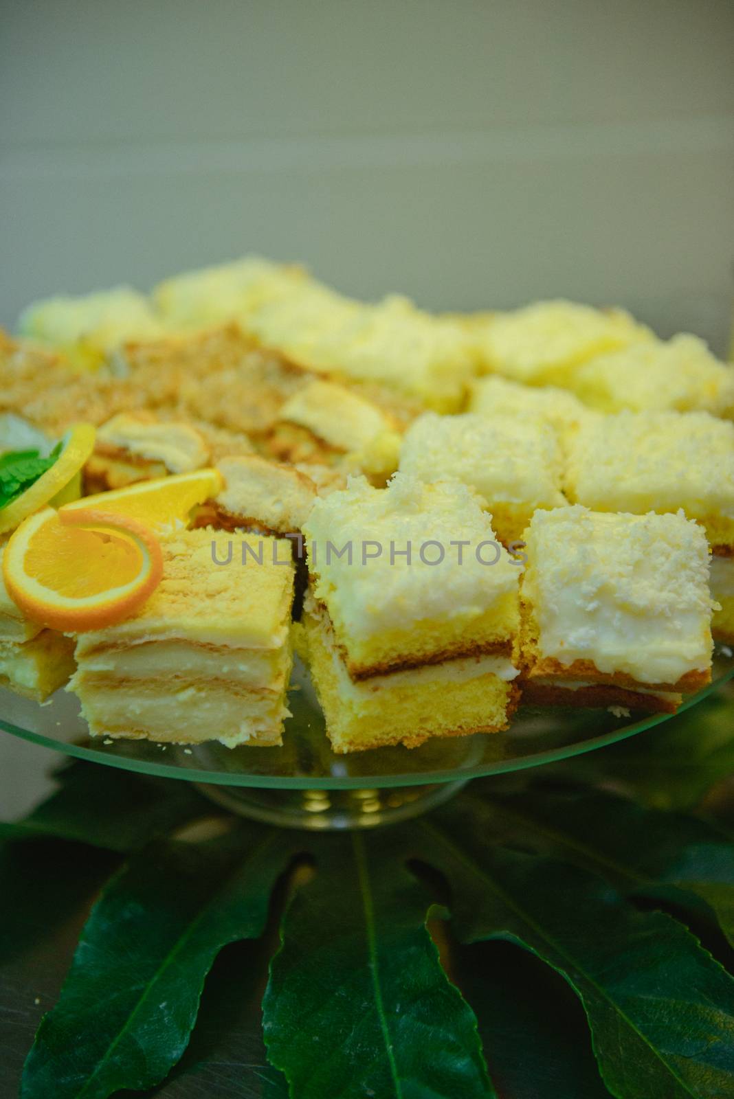 Delicious sweets on candy buffet. Wedding bakes on trays.