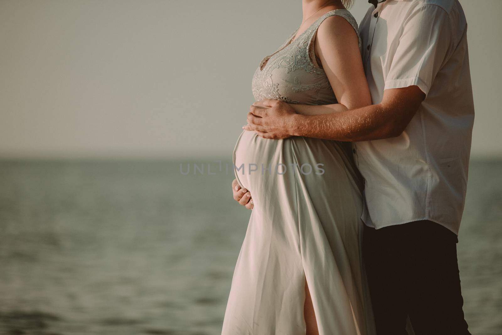 Bride and groom at a photo session in the nature. Baltic sea beach.