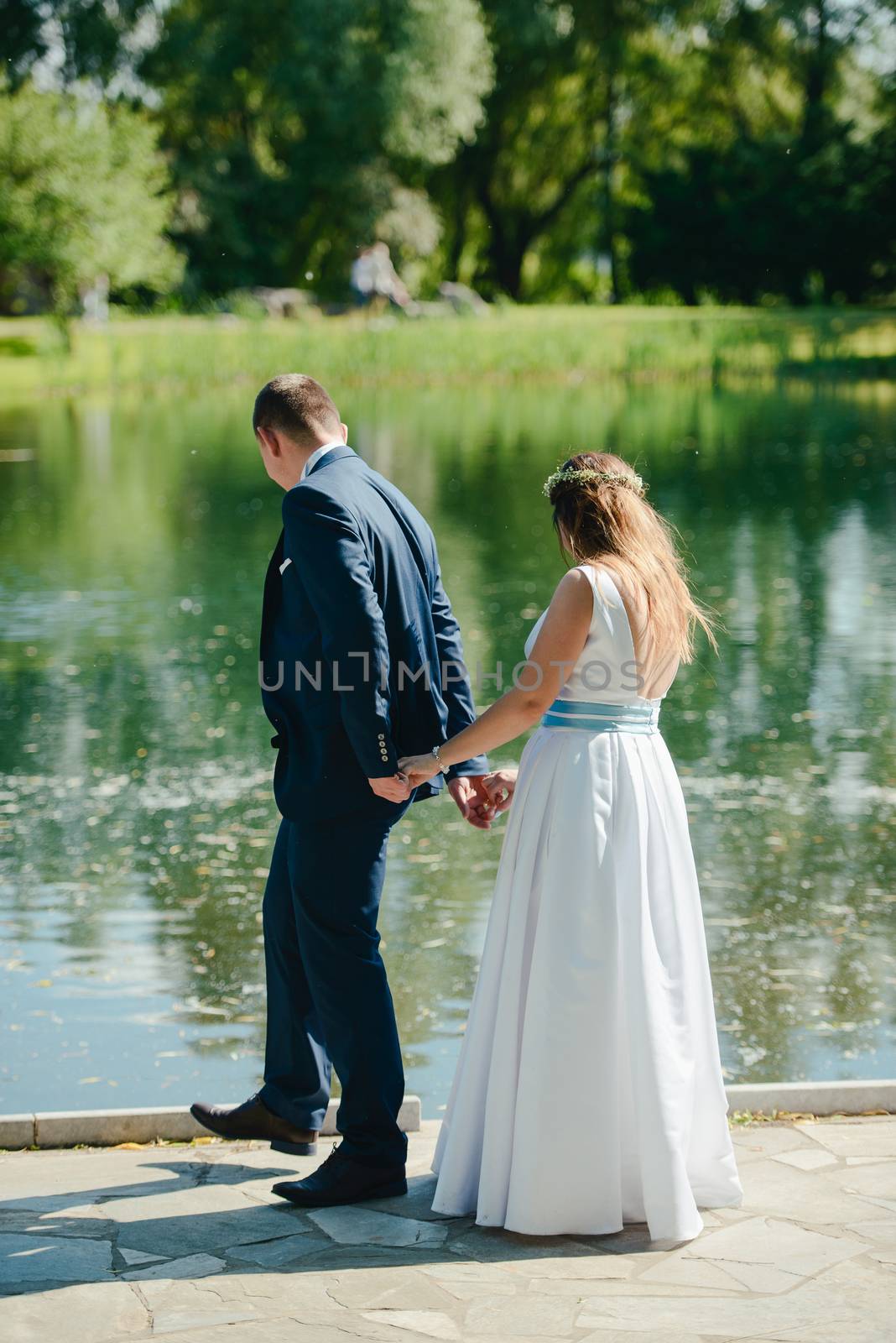 Bride and groom at a photo session in the nature.