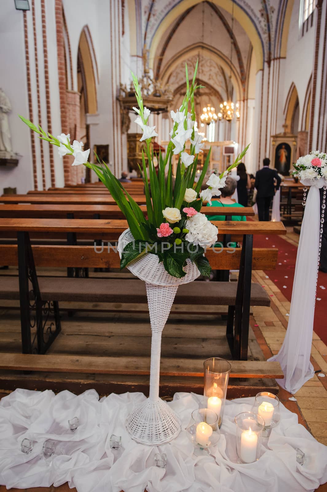 Church sanctuary before a wedding ceremony. Empty chairs for bride and groom