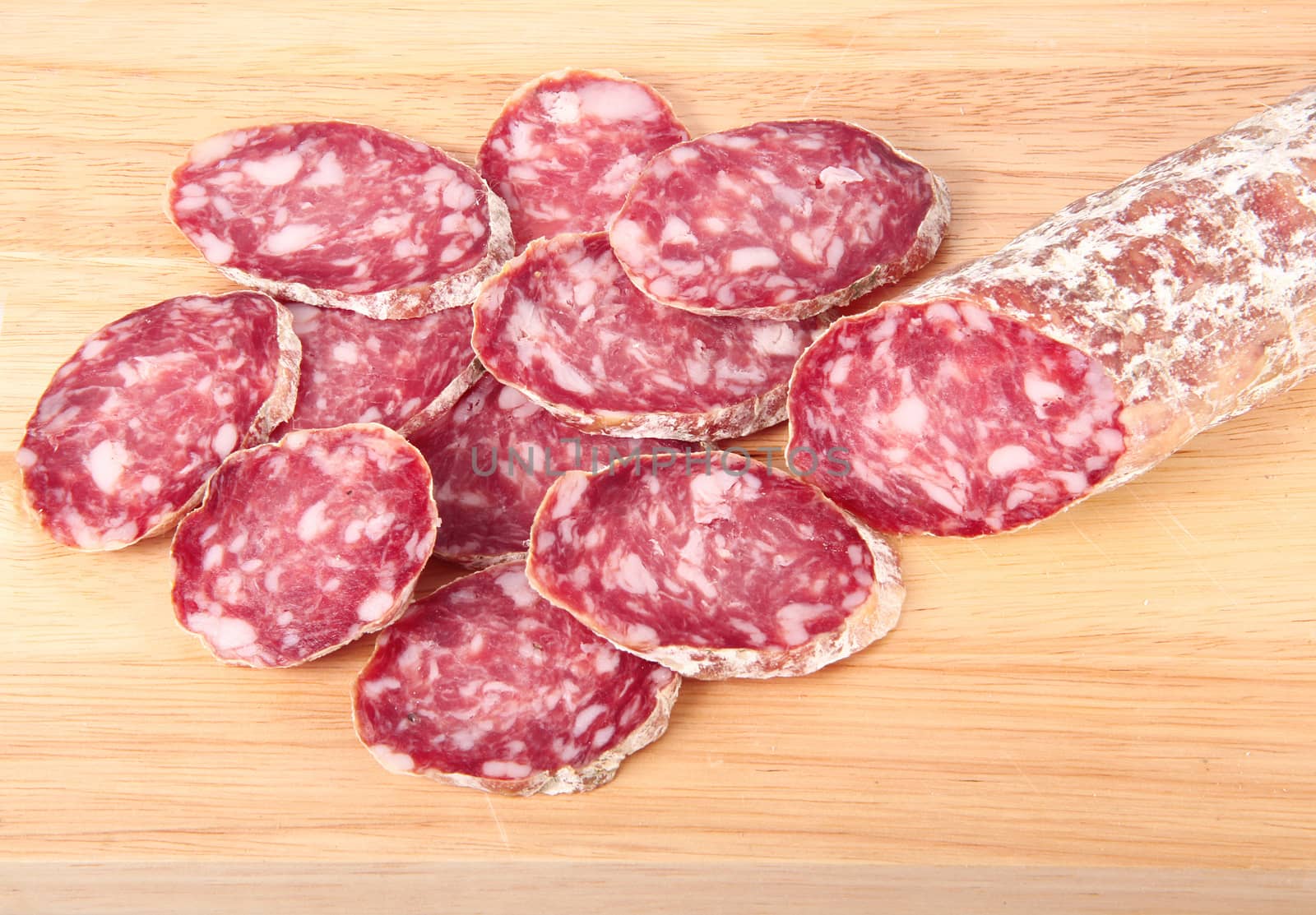 italian salami slices on chopping board background