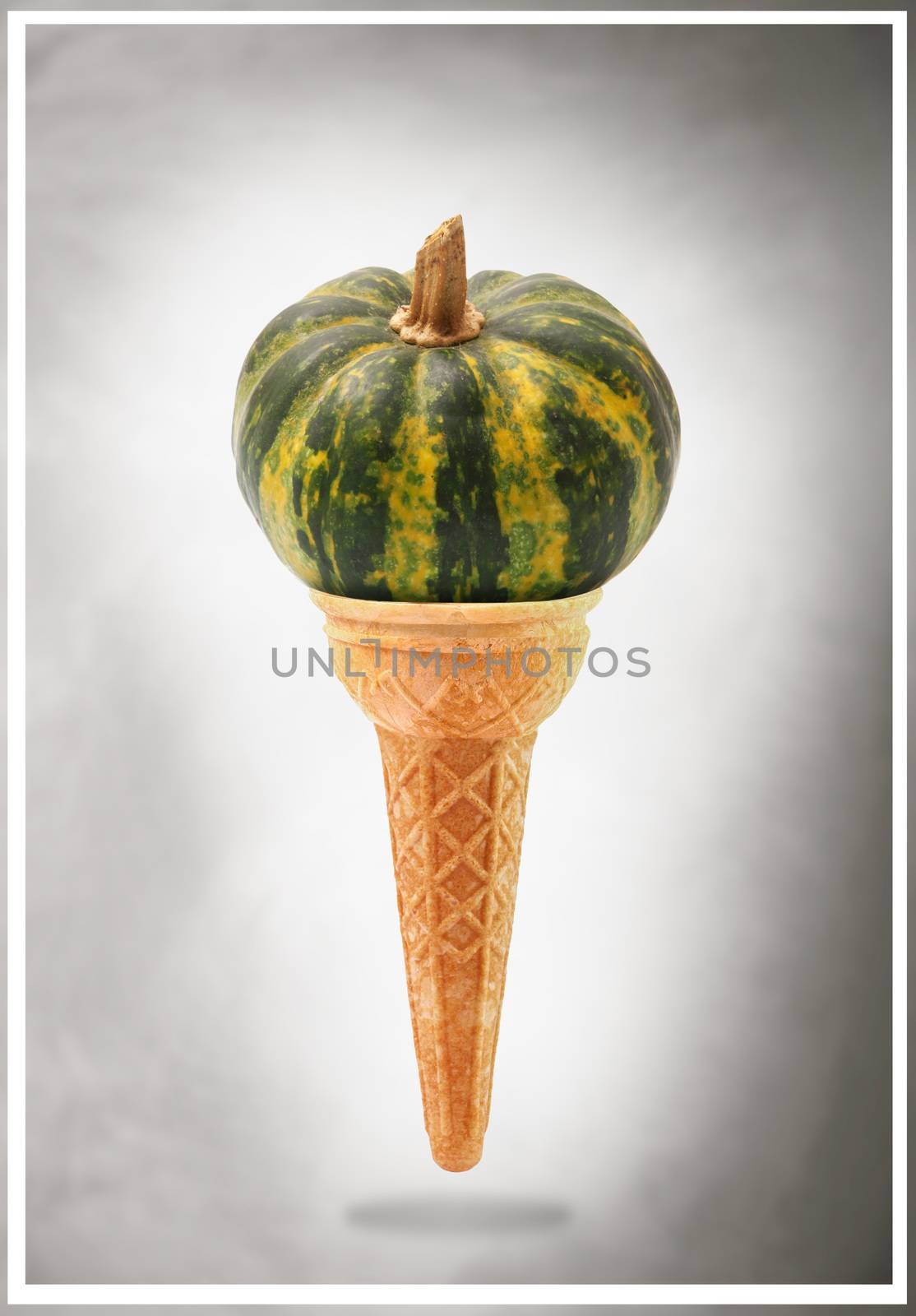 a Delicious ice cream cone flavored with pumpkin