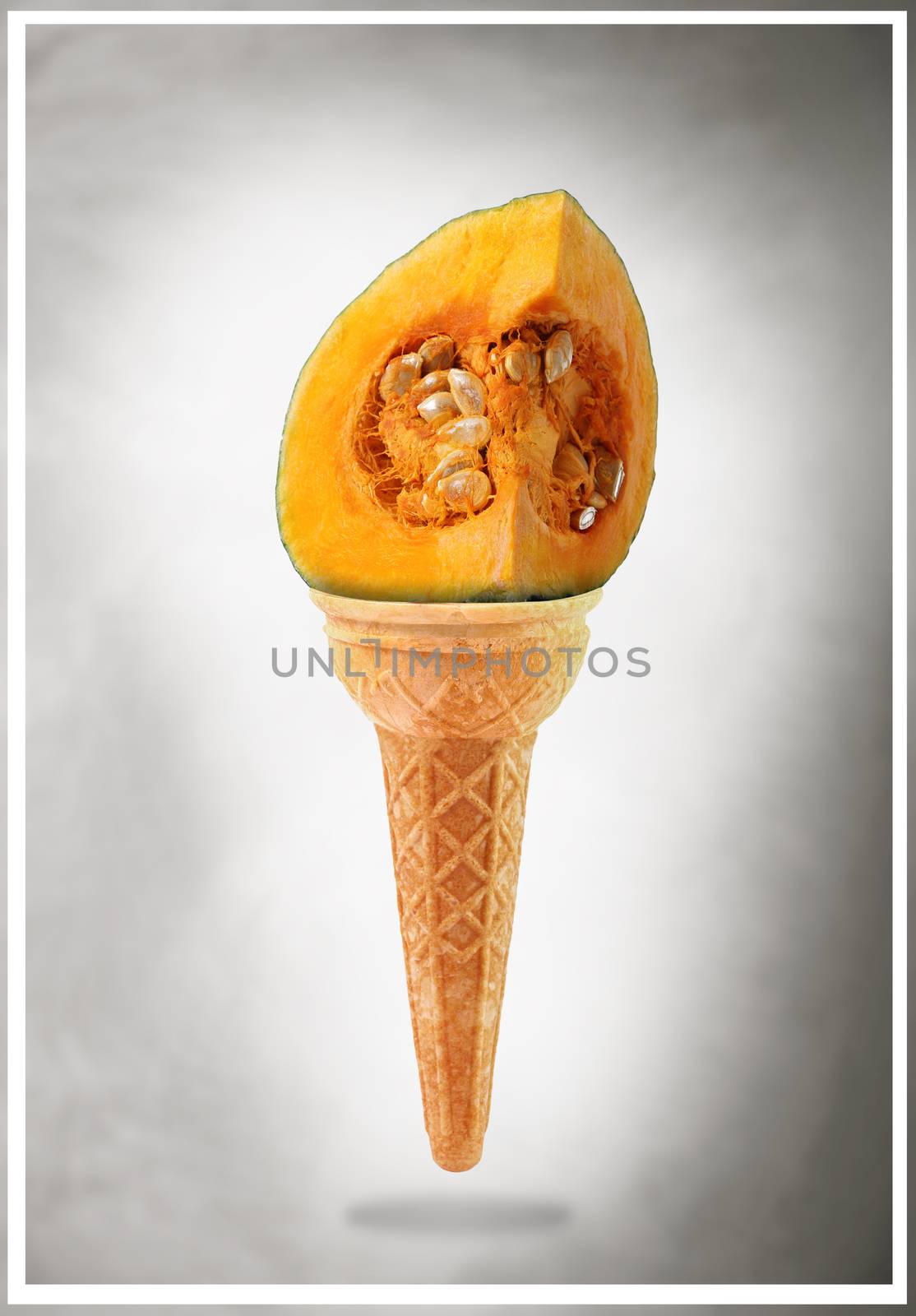 a Delicious ice cream cone flavored with pumpkin