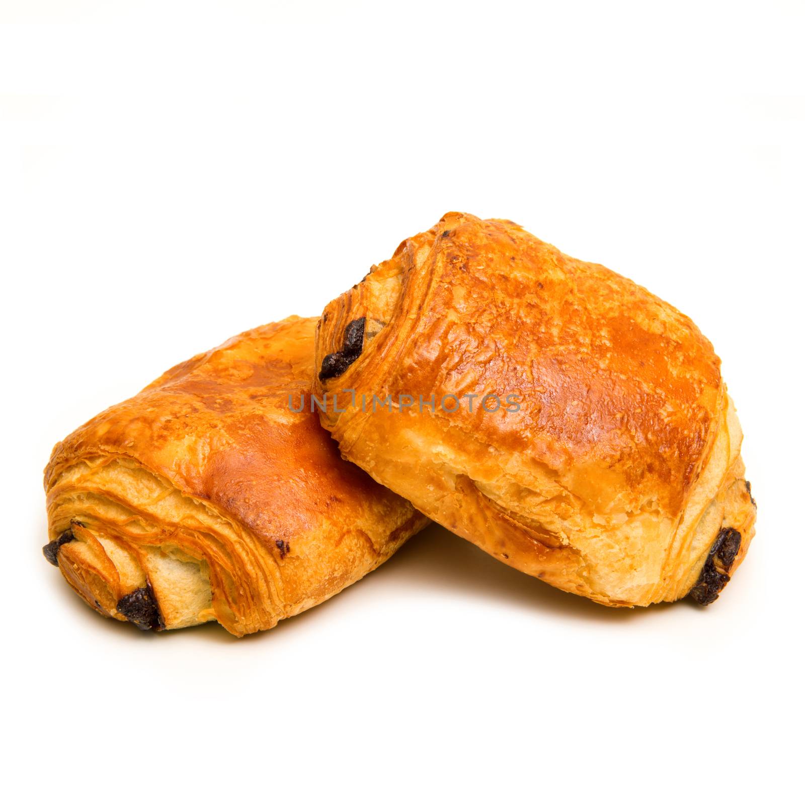 fresh french croissant with chocolate on white background