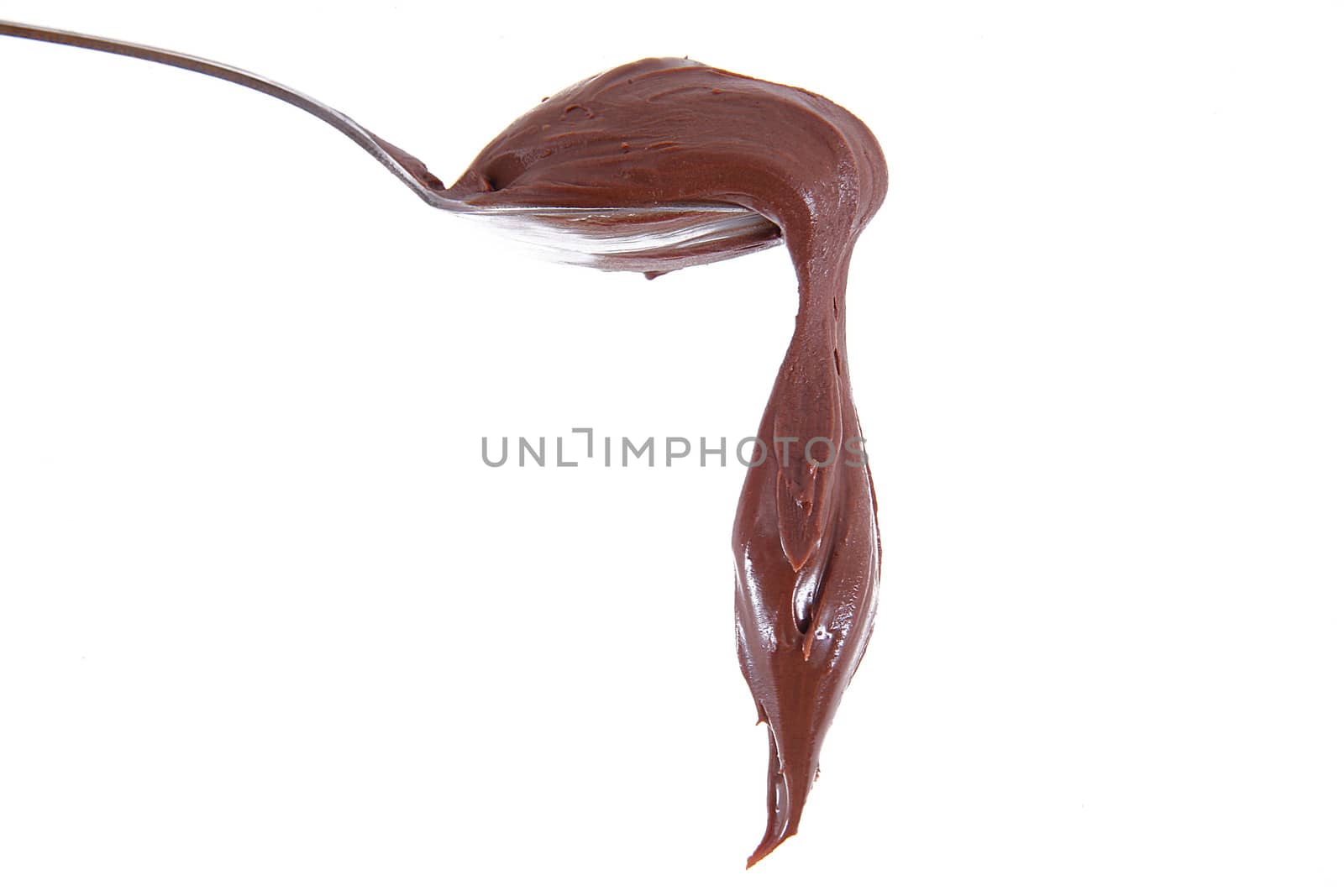isolated chocolate cream on spoon on white background