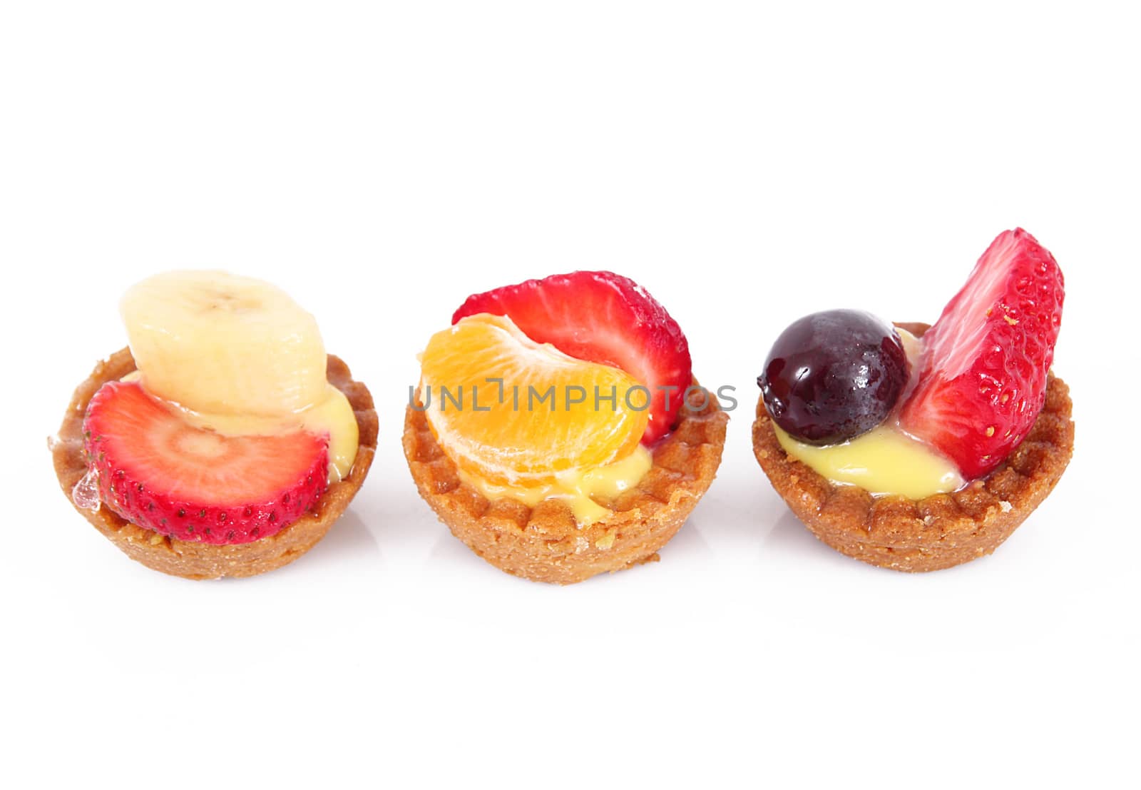delicious fruit pastries on white background