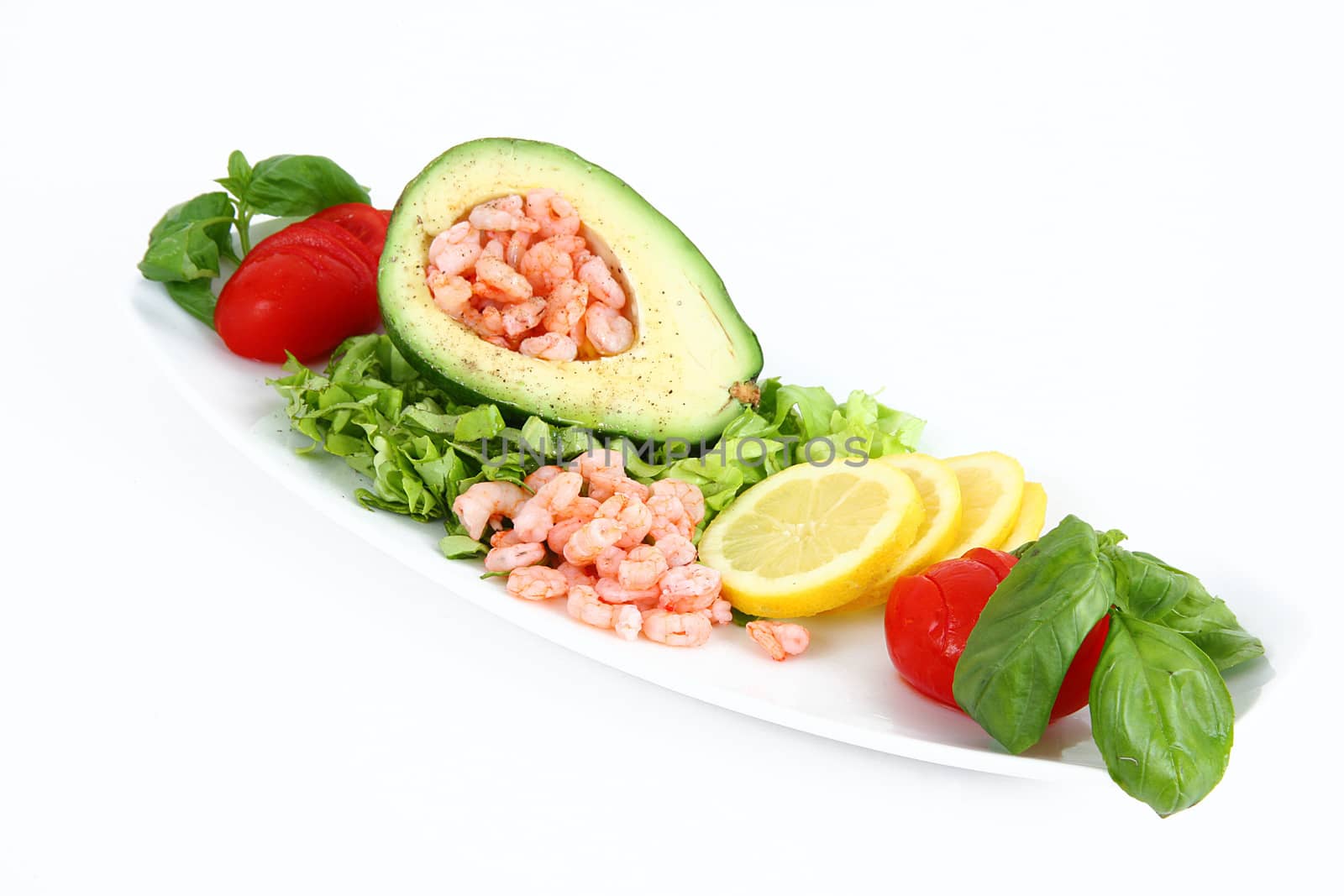 avocado with shrimps on white background