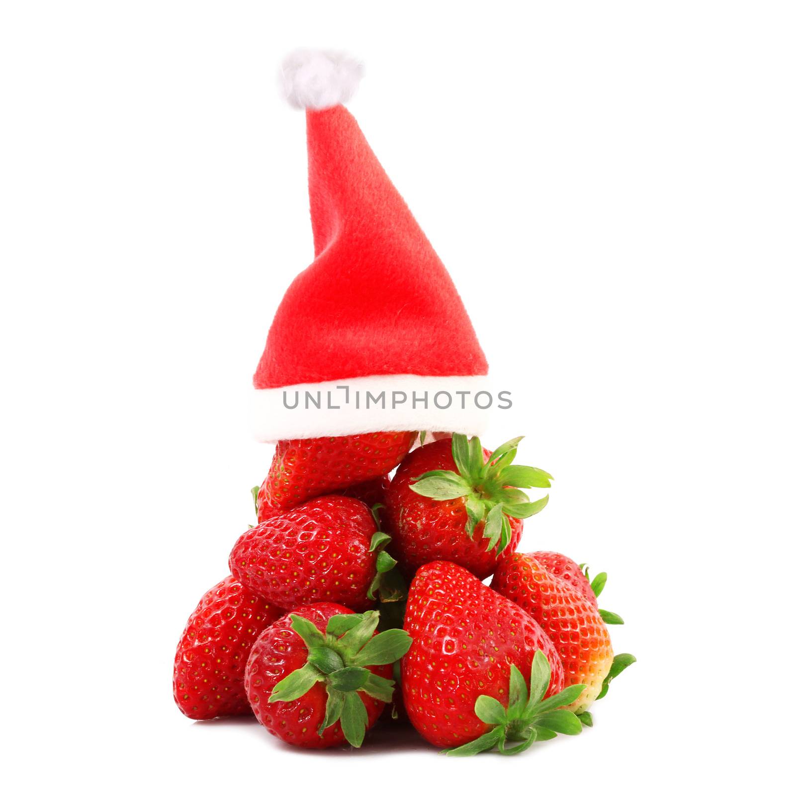 fresh strawberries on white background with christmas hat