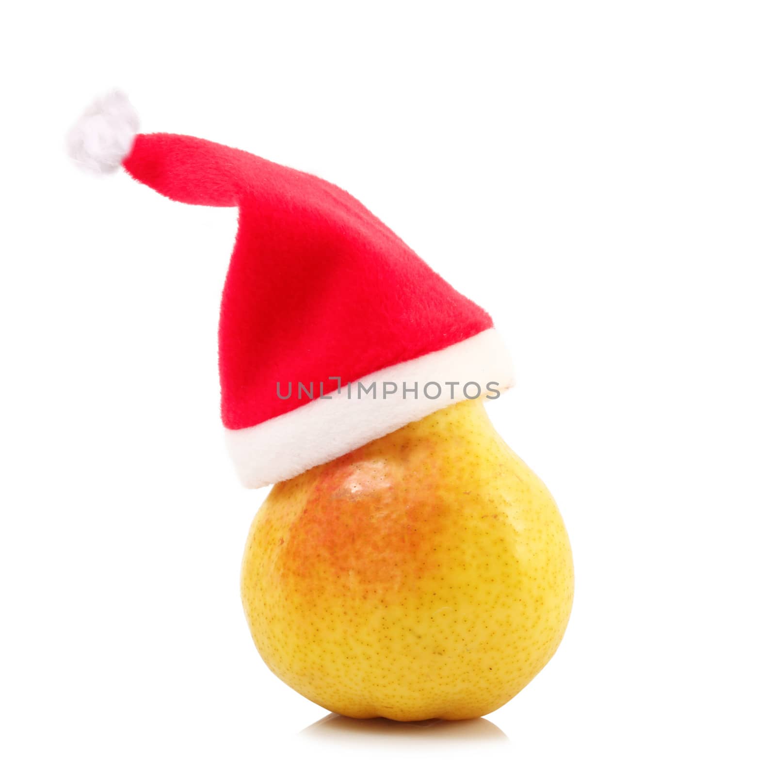 fresh pear with christmas hat on white background