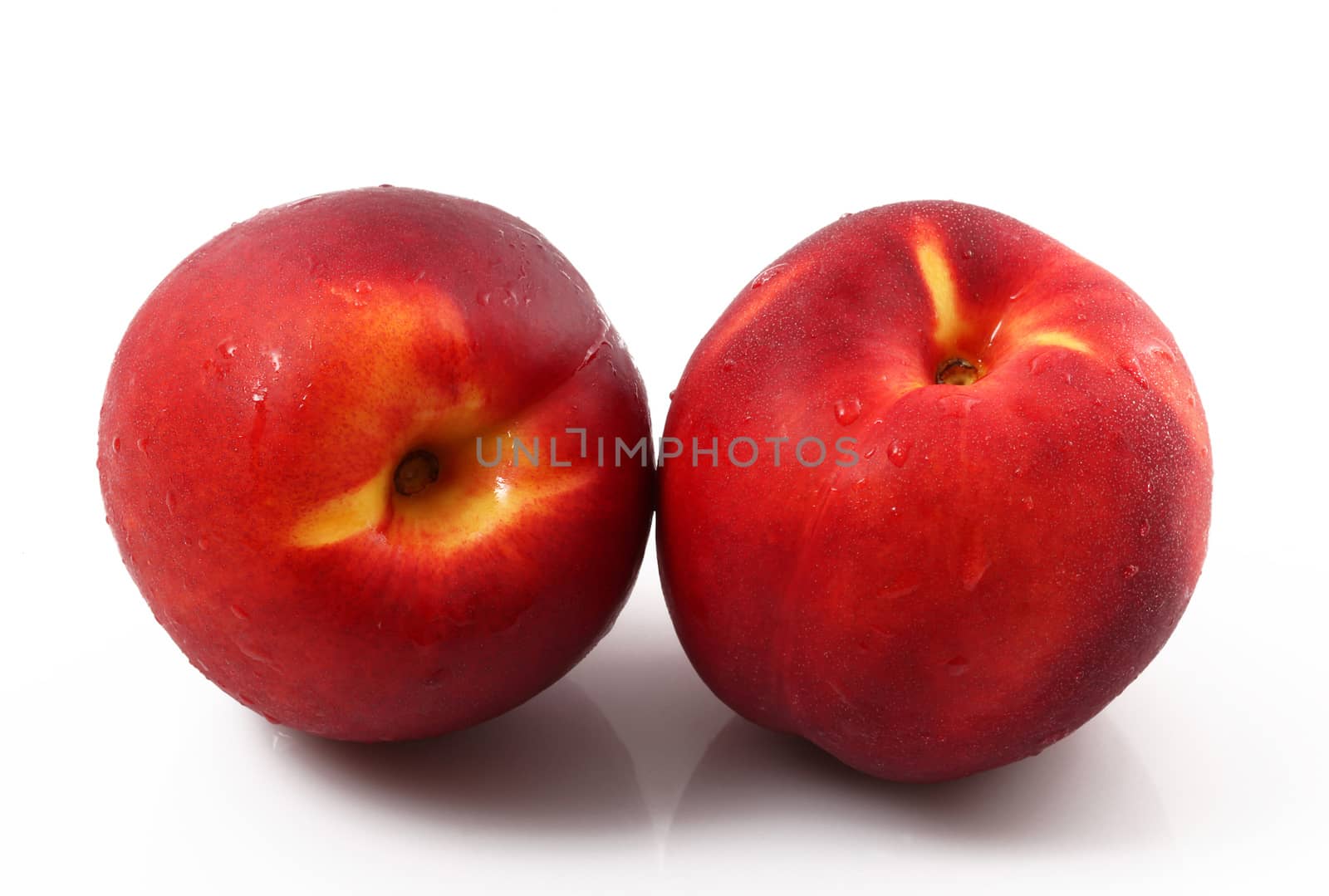 fresh peaches on white background