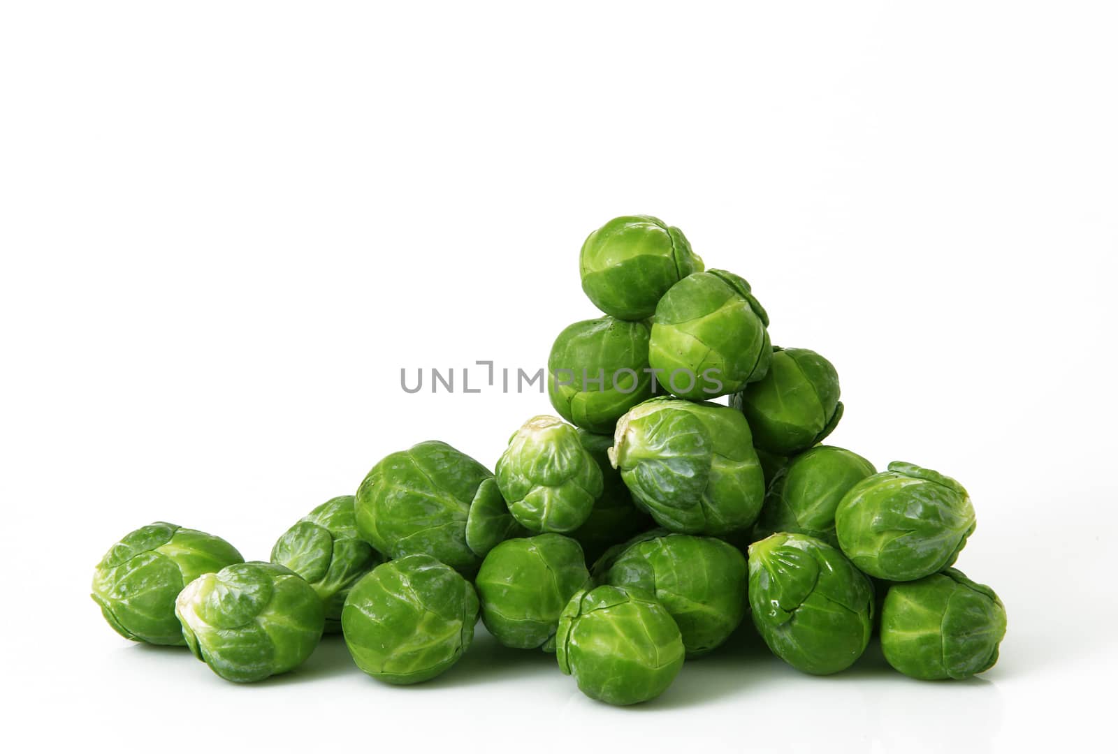 fresh brussels sprouts on white background