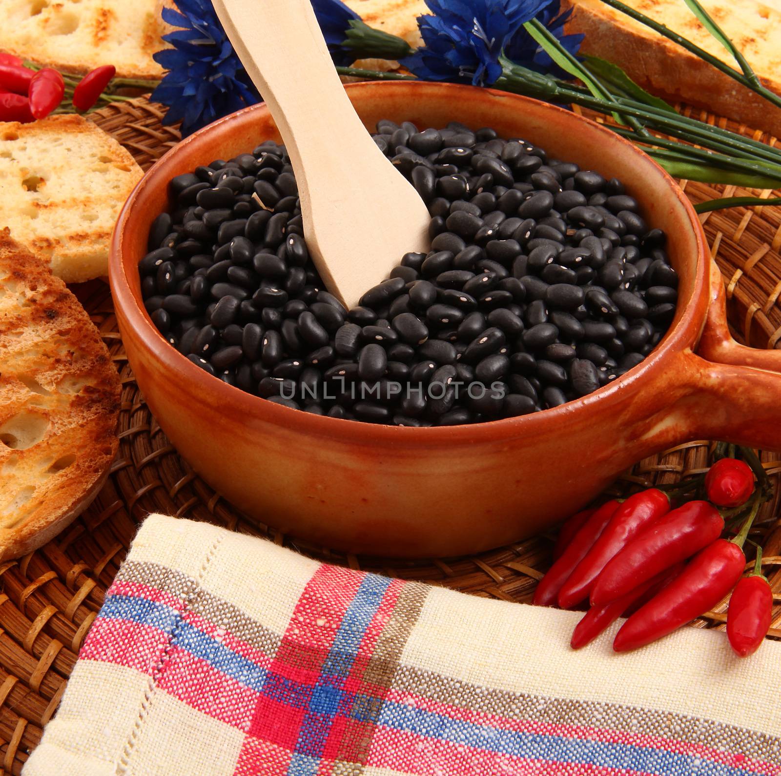 dry legumes in rustic dish on wooden table