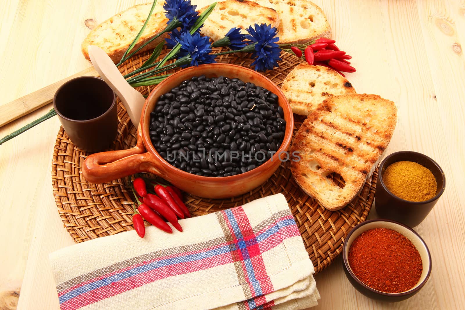 dry legumes in rustic dish on wooden table
