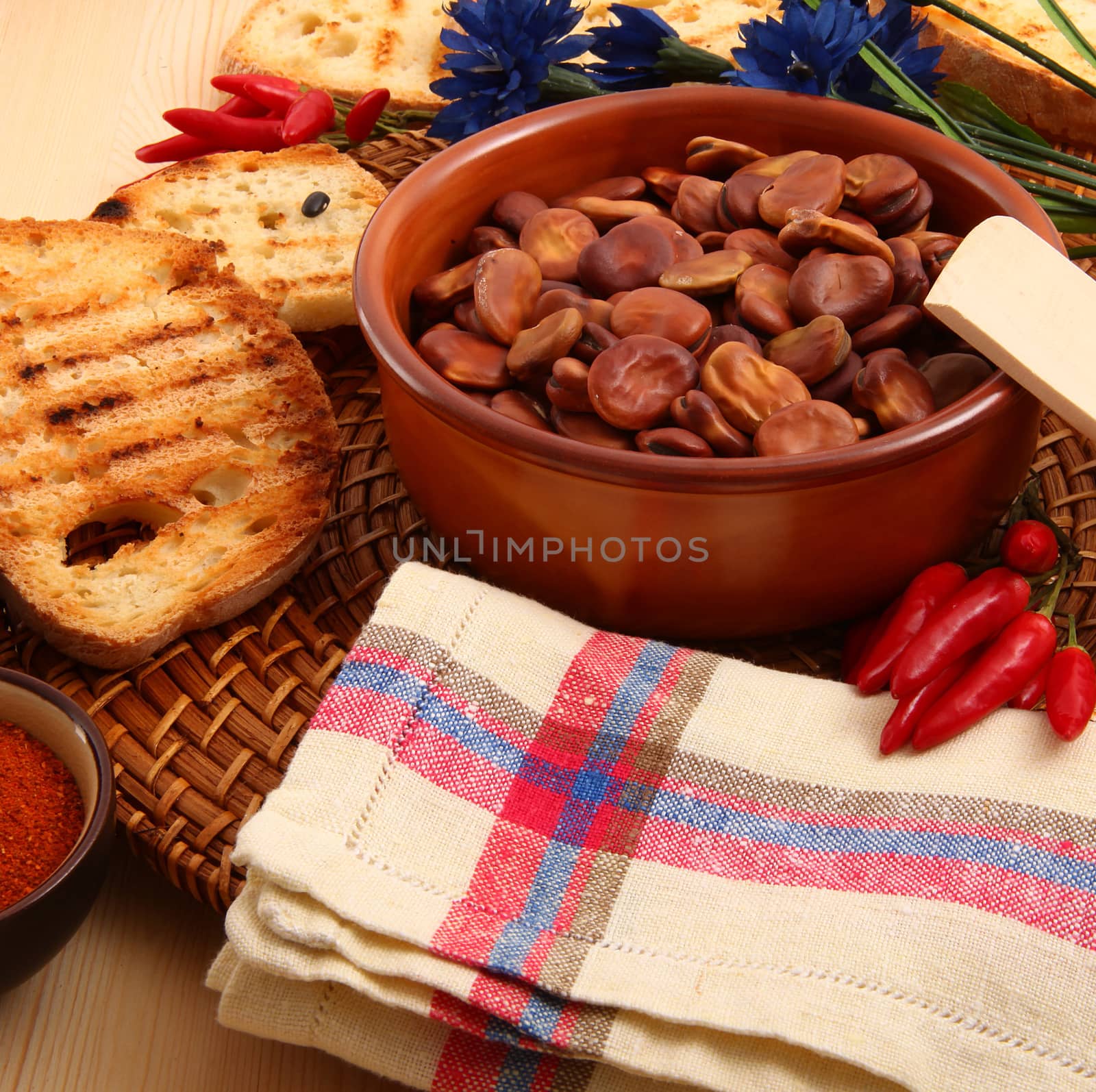 dry legumes in rustic dish on wooden table