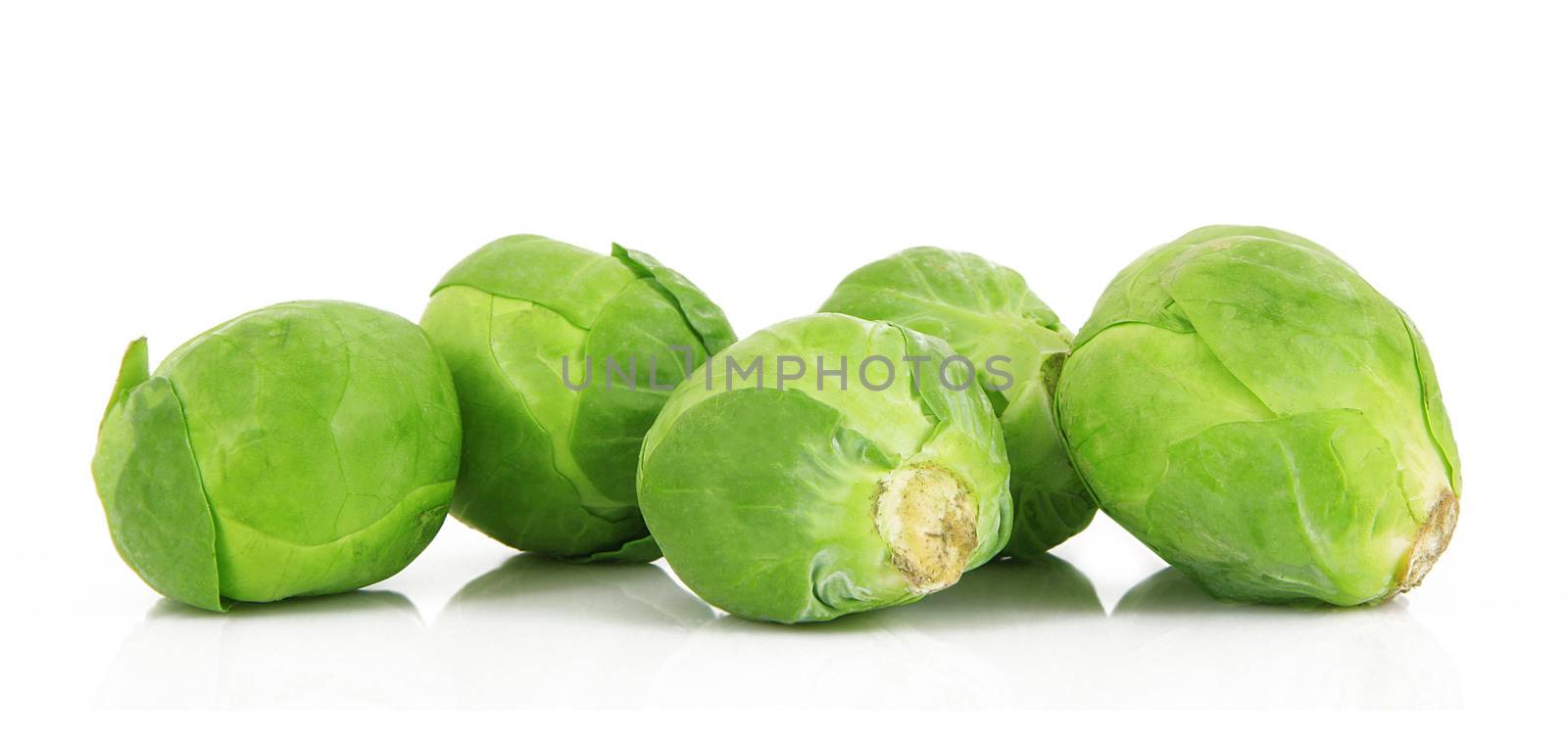 fresh brussels sprouts on white background